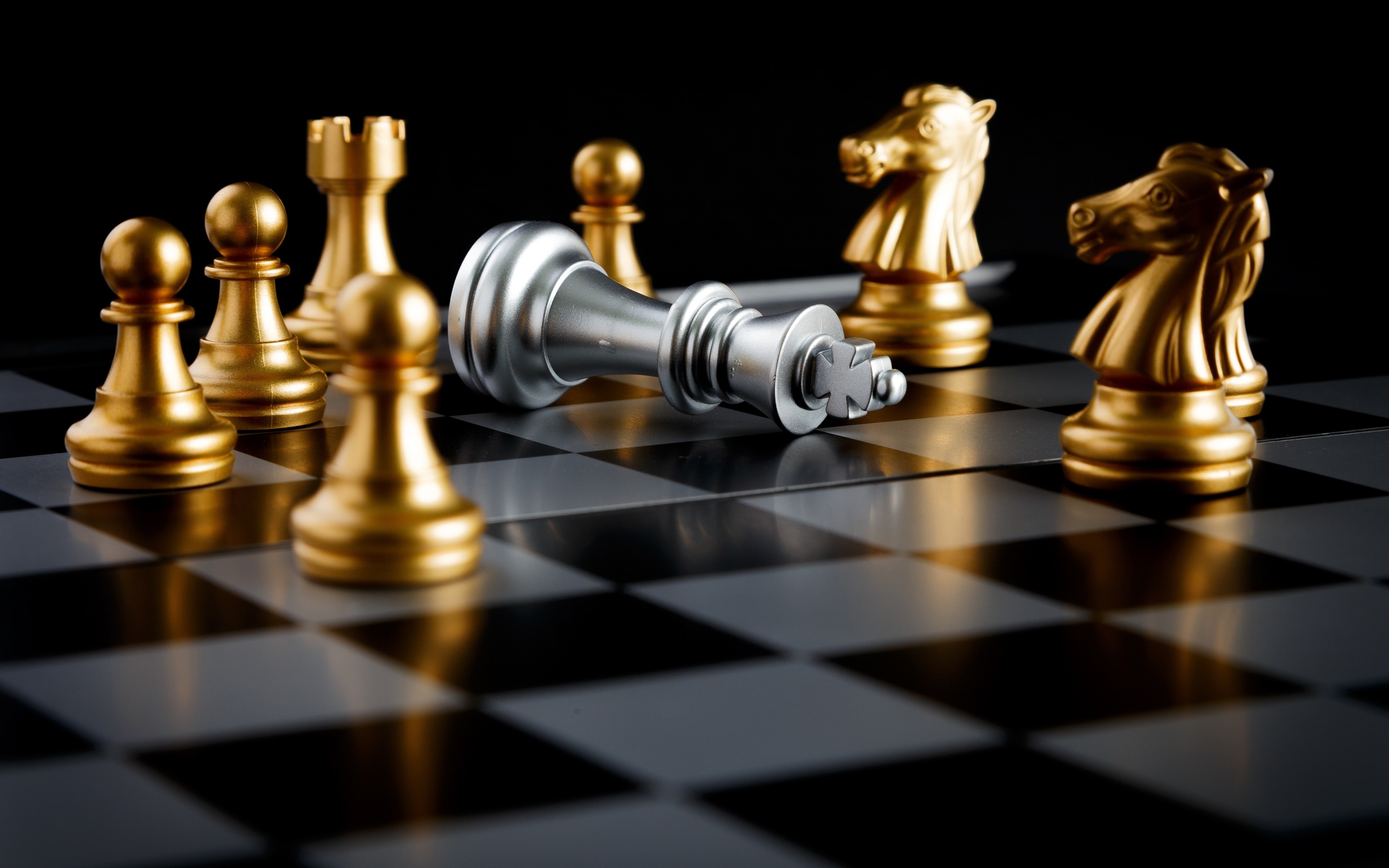 Wallpaper / conflict, aggression, chess board, indoors, chess piece, golden, confrontation, leisure activity, international, knight piece, black background free download