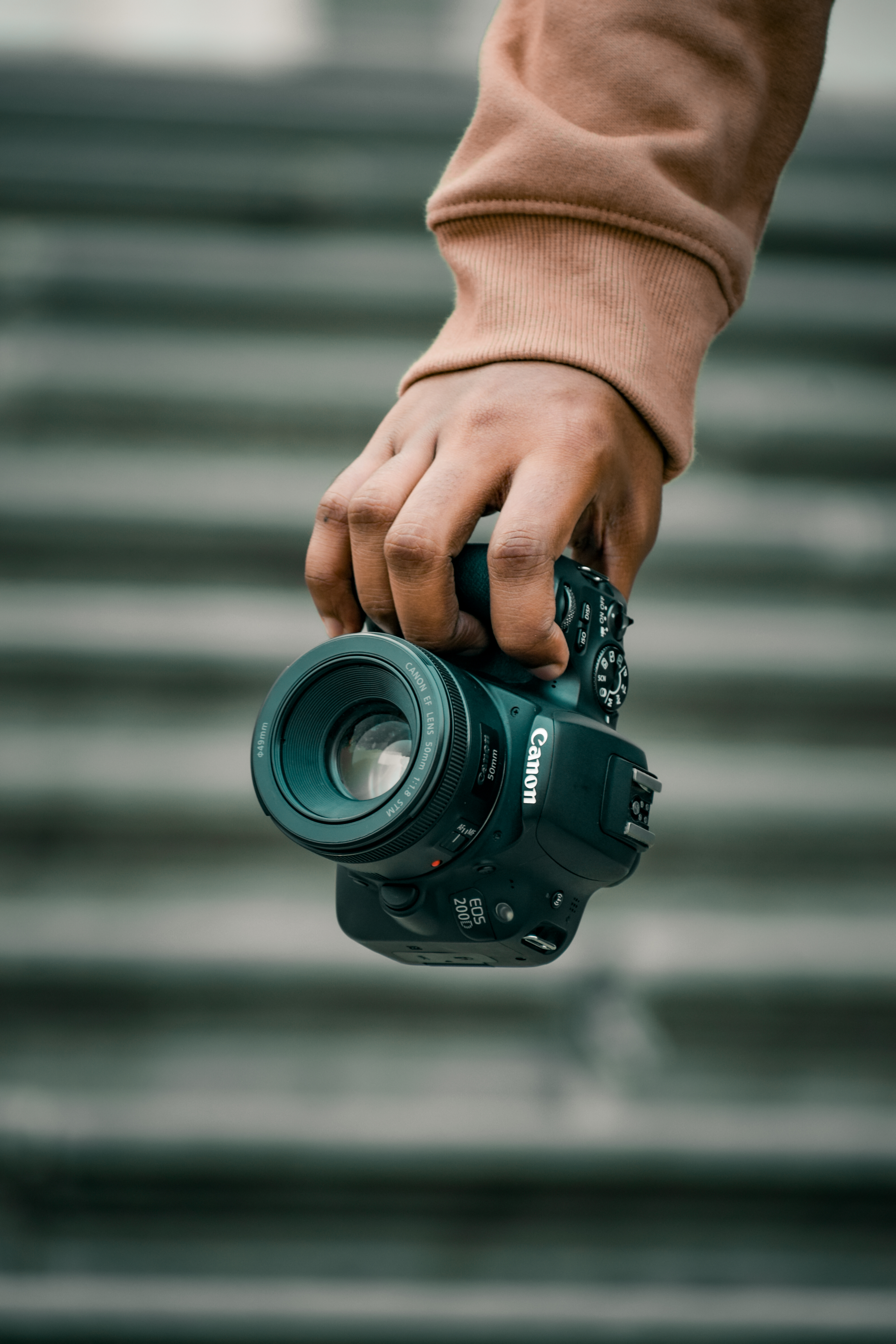 Person Holding Black Canon Camera · Free
