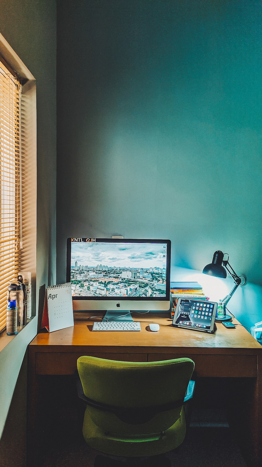 Silver imac on brown wooden desk photo