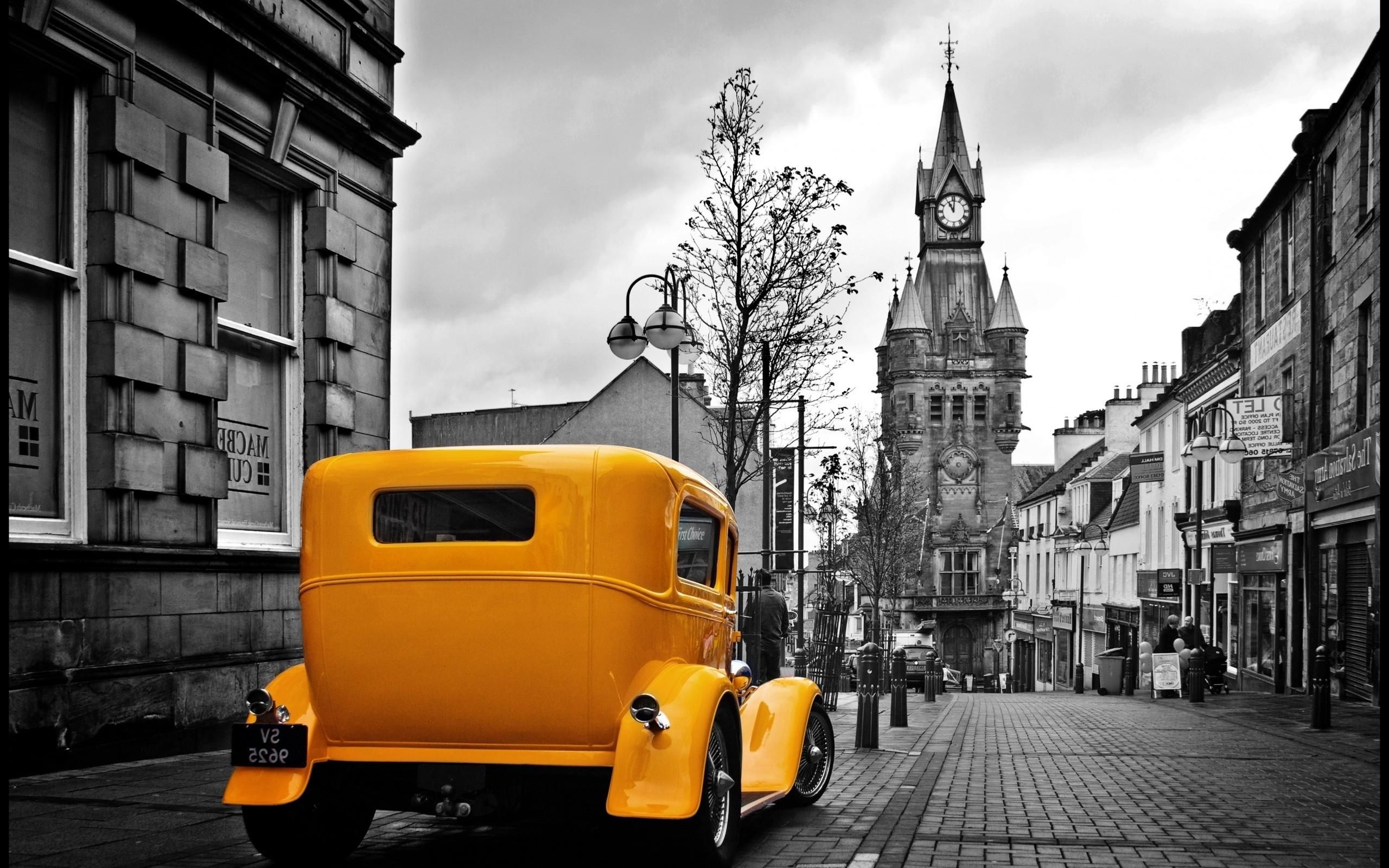 Download HD wallpaper of Vintage Yellow Car In A Gray City. Free download High Quality and Widescreen Resolutions Desk. Yellow car, City wallpaper, Classicliving