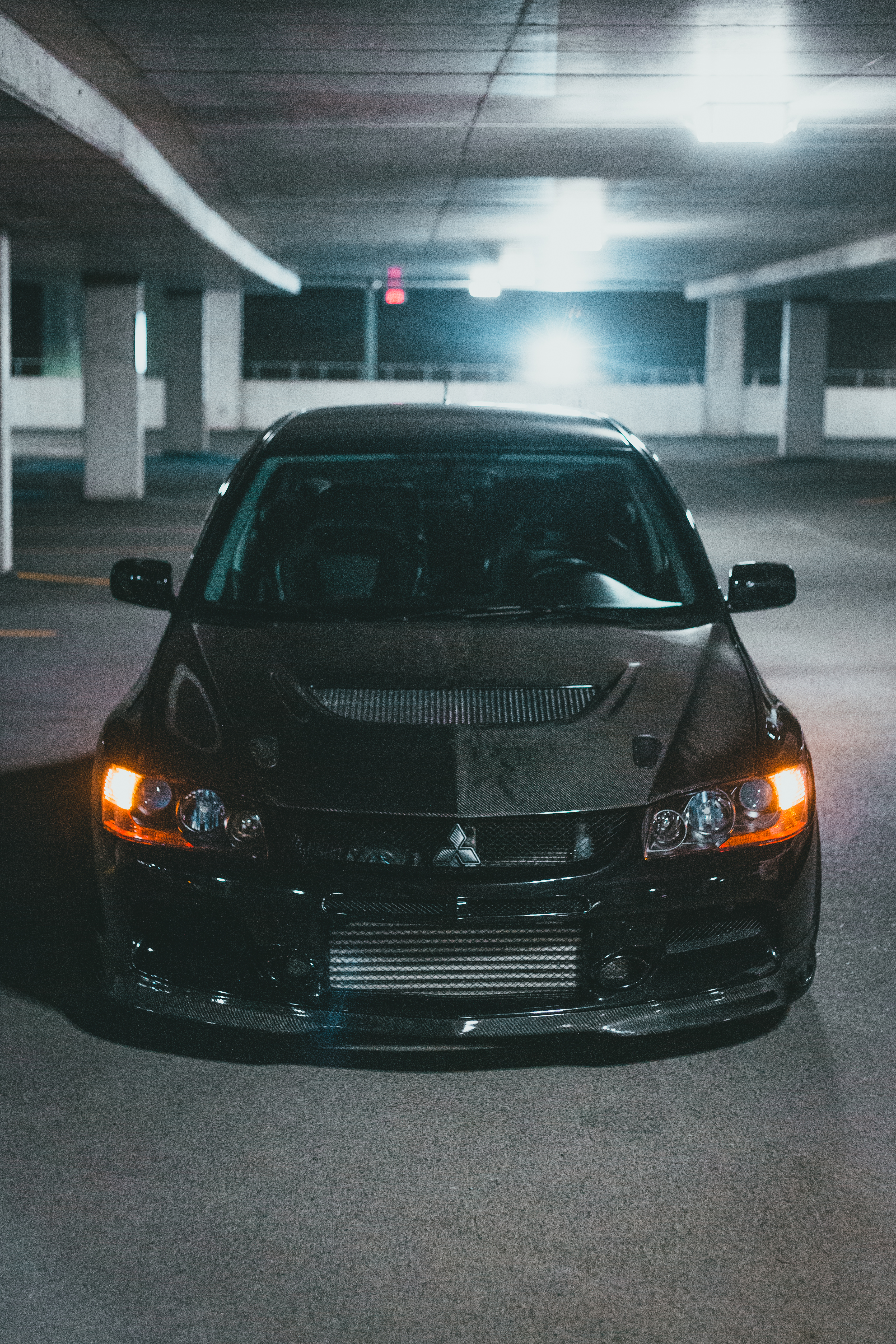 A Black Mitsubishi Lancer Evolution in a Parking Lot · Free