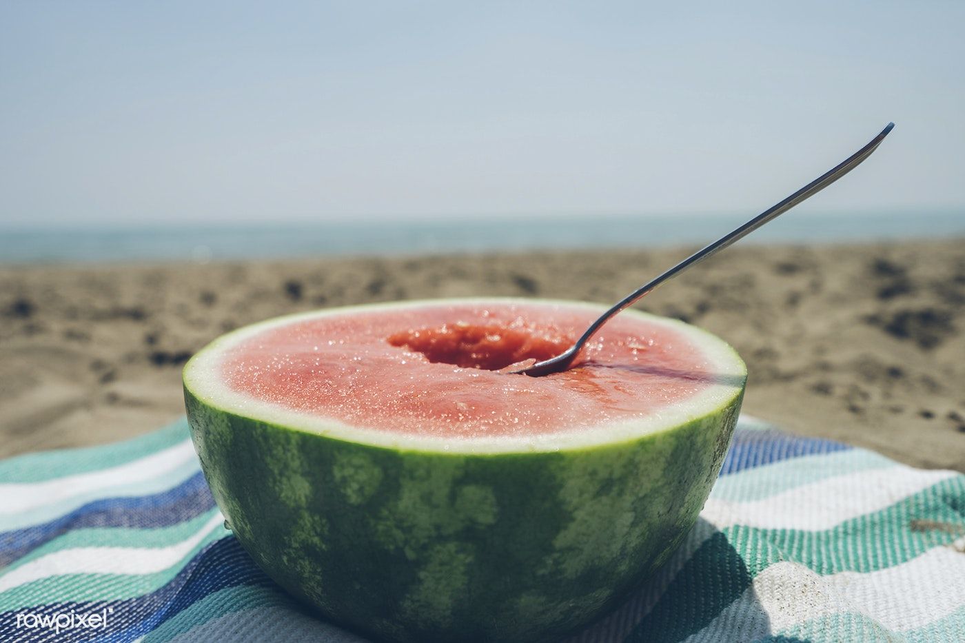 Half of a watermelon on the beach. free image / Scott Webb. Watermelon, Summer watermelon, Summer fruit