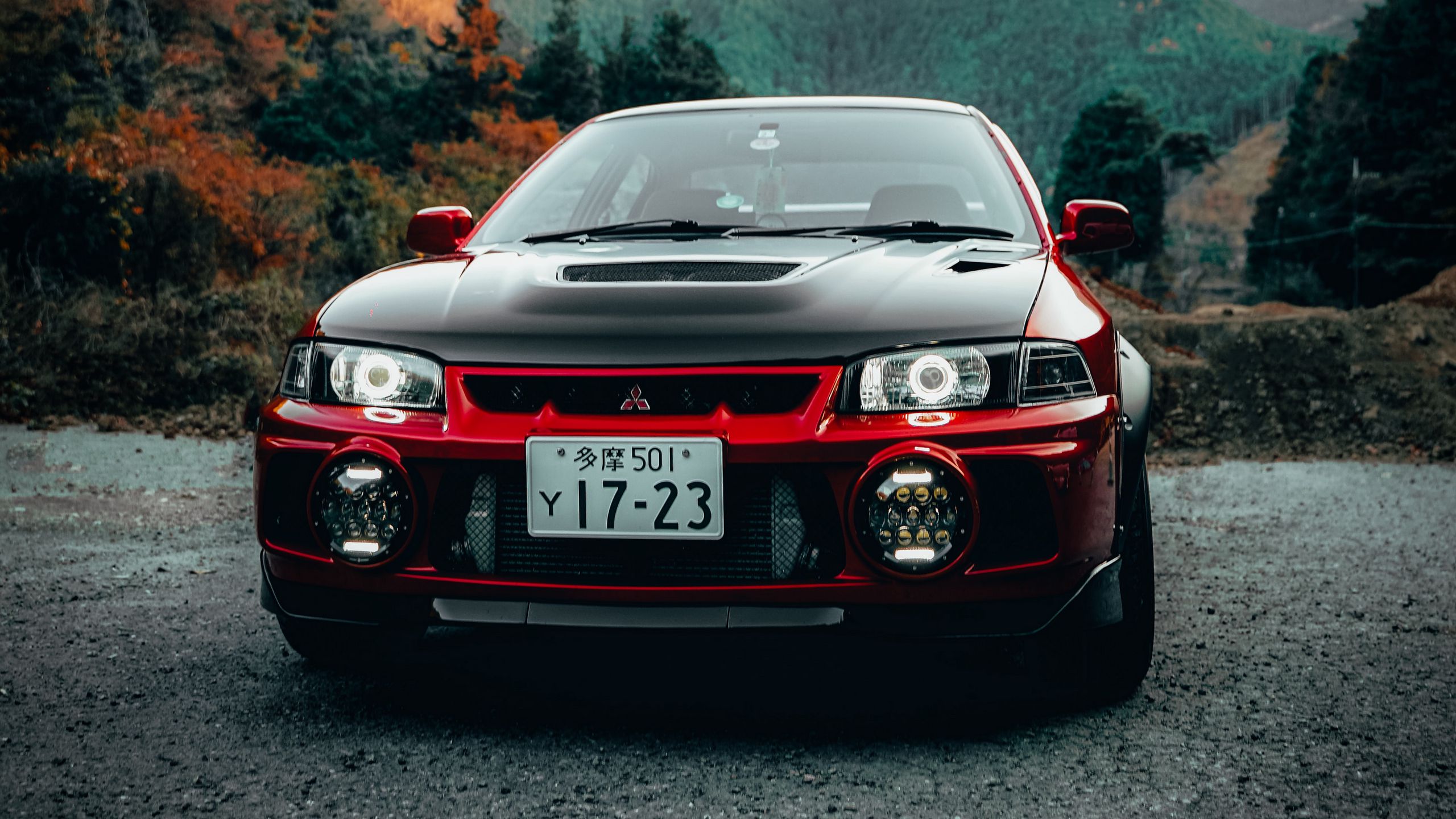 Download wallpaper 2560x1440 mitsubishi lancer evolution, mitsubishi, car, red, black, front view widescreen 16:9 HD background