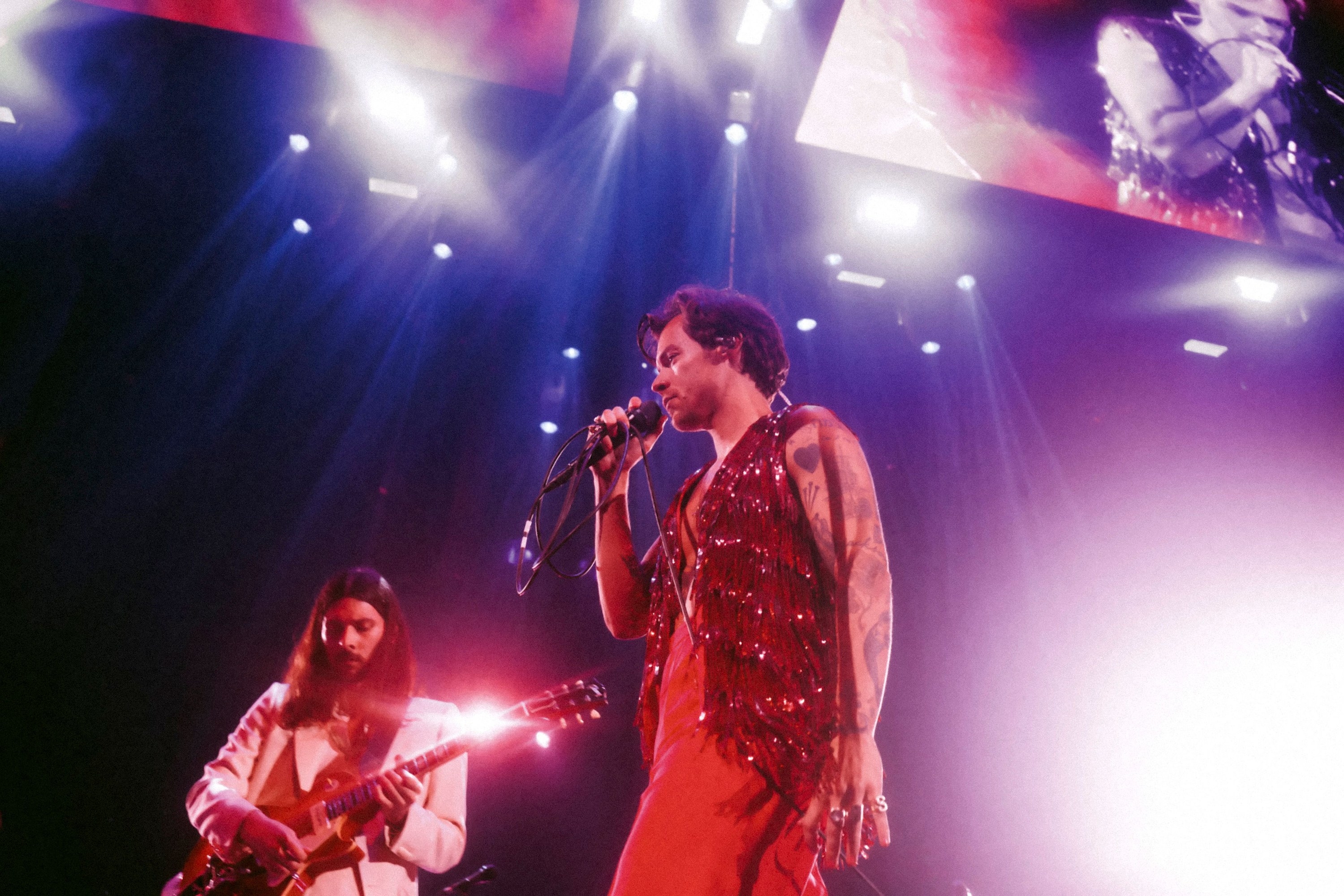 Harry Styles Is Criticized For Spitting On Fans