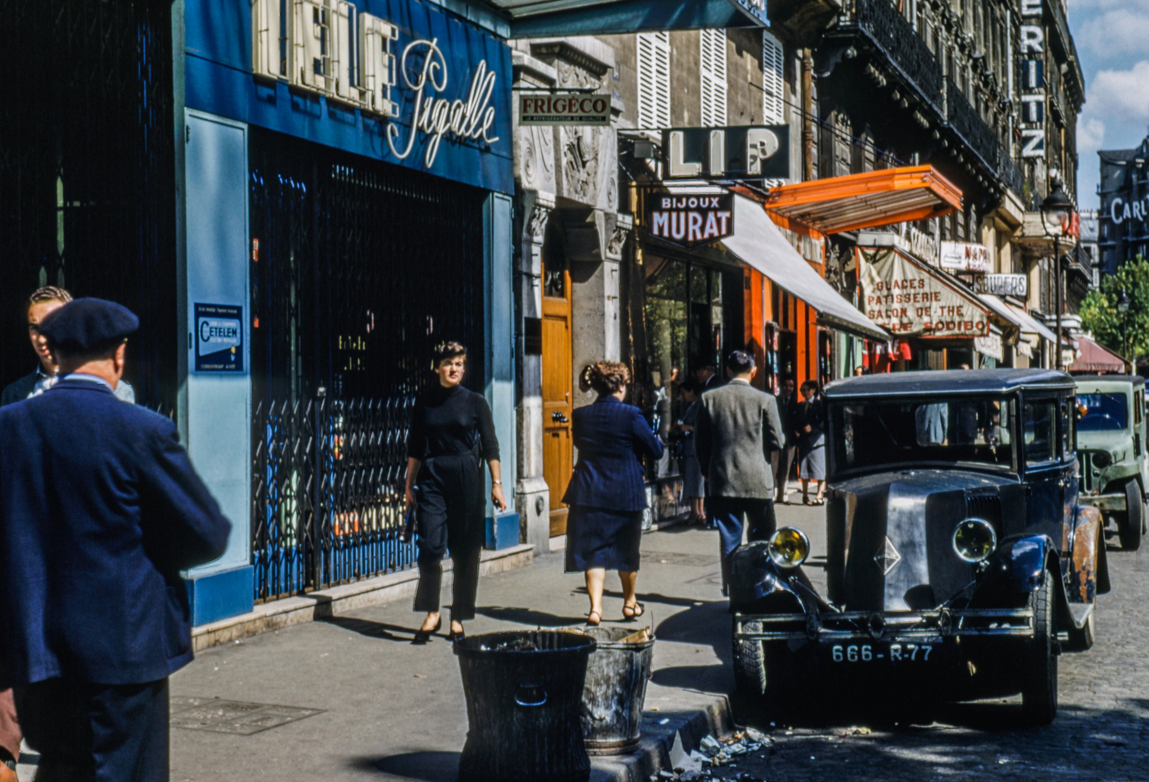 Wallpaper / an old shot of a sidewalk in paris with vintage cars parked nearby, vintage paris street 4k wallpaper free download
