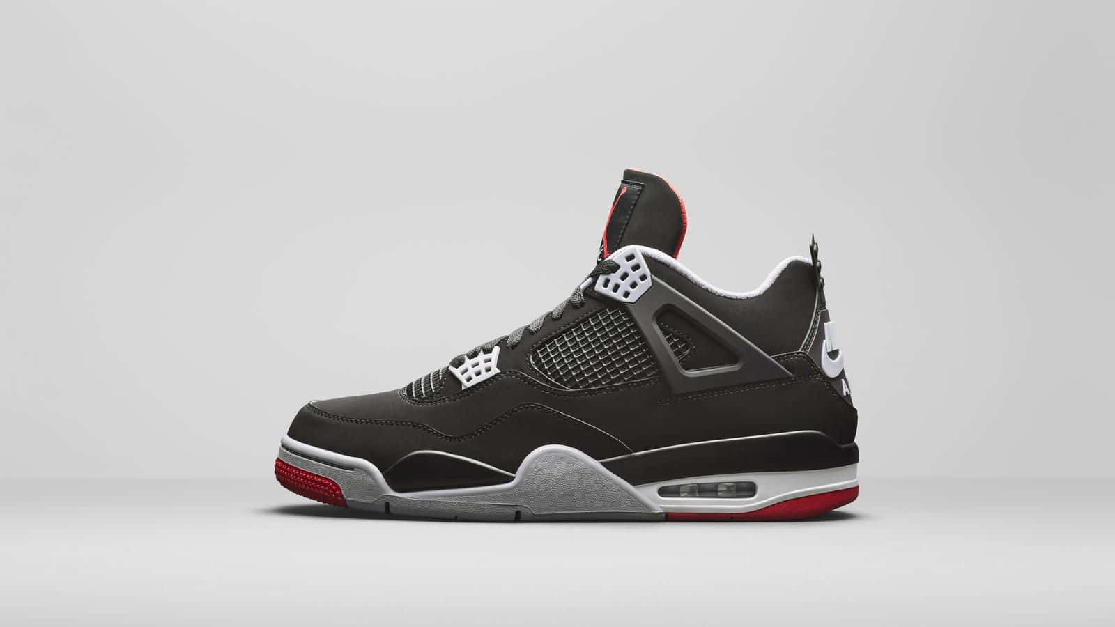 Download Get Your Hands On The Iconic Air Jordan 4 Wallpaper
