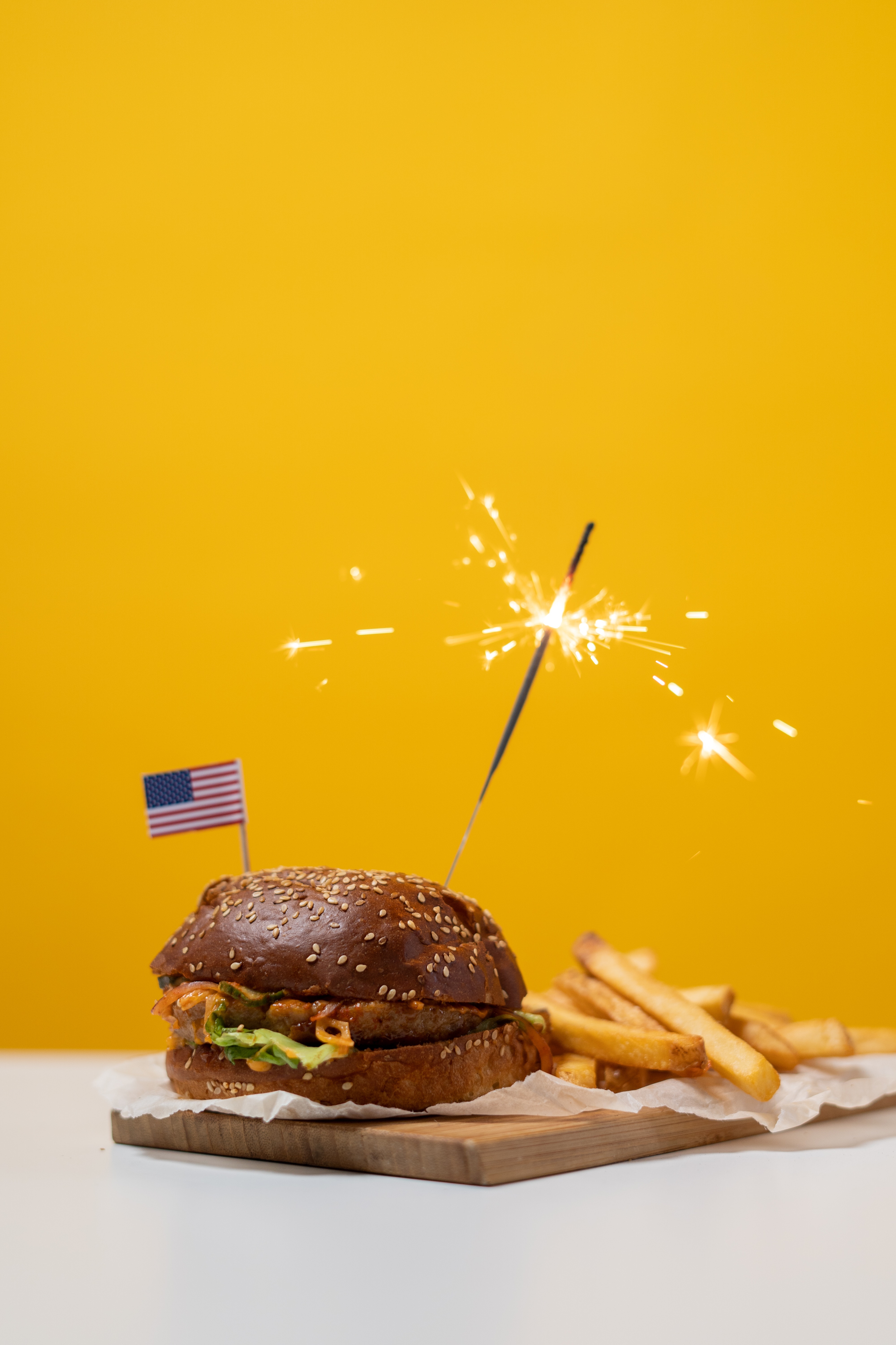 Burger With Fries on Yellow Background · Free