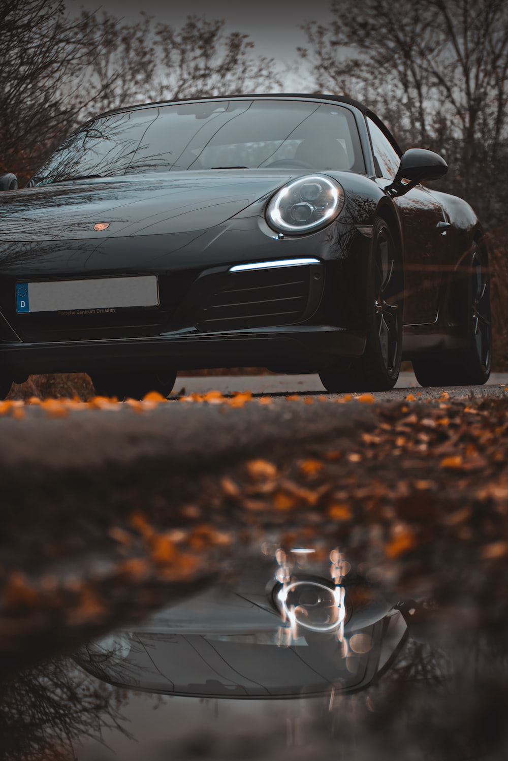 Black porsche 911 on road photo
