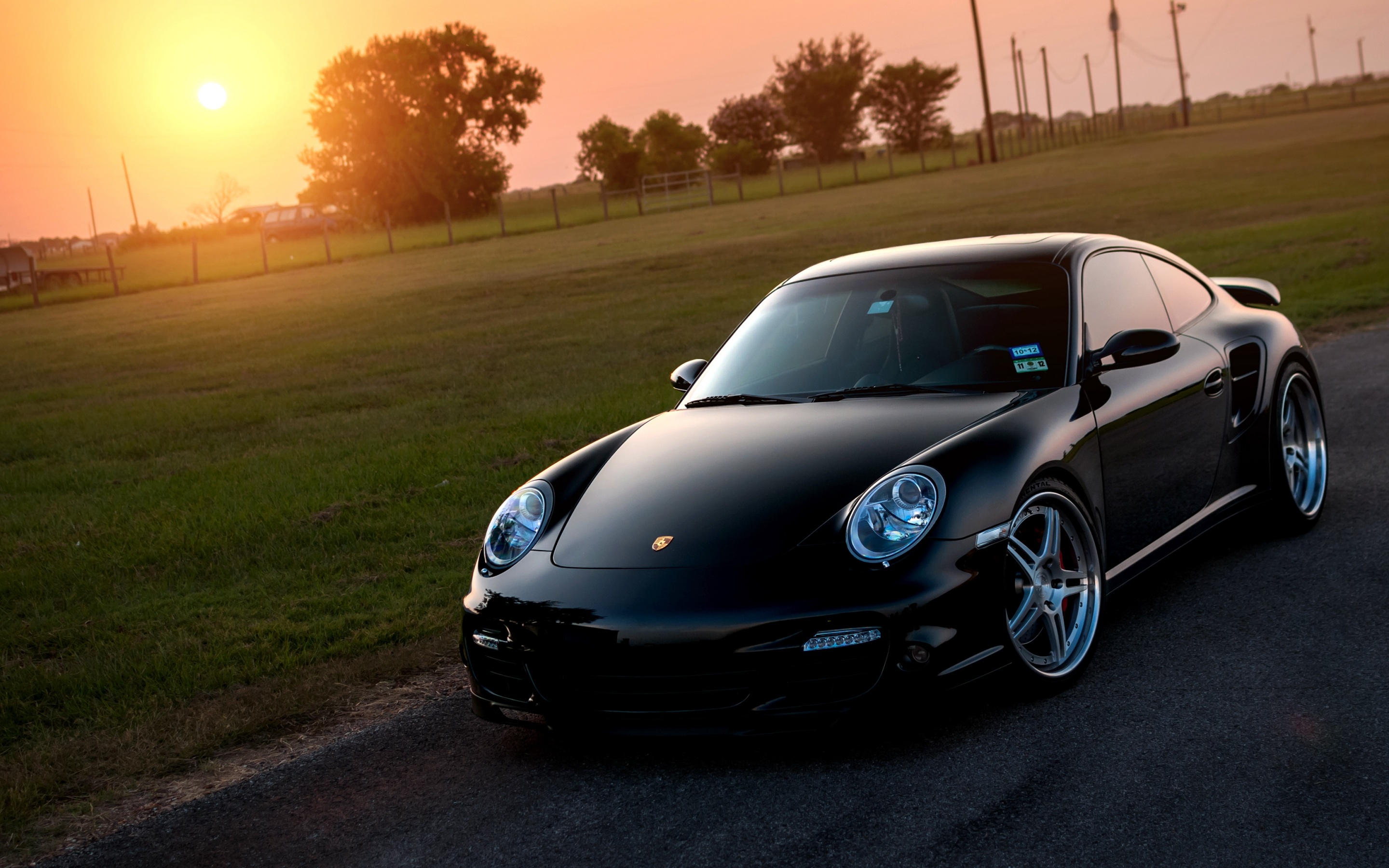 Wallpaper 4k porsche, 911, turbo, 997, black, front, sun, grass, reflections 4k Wallpaper