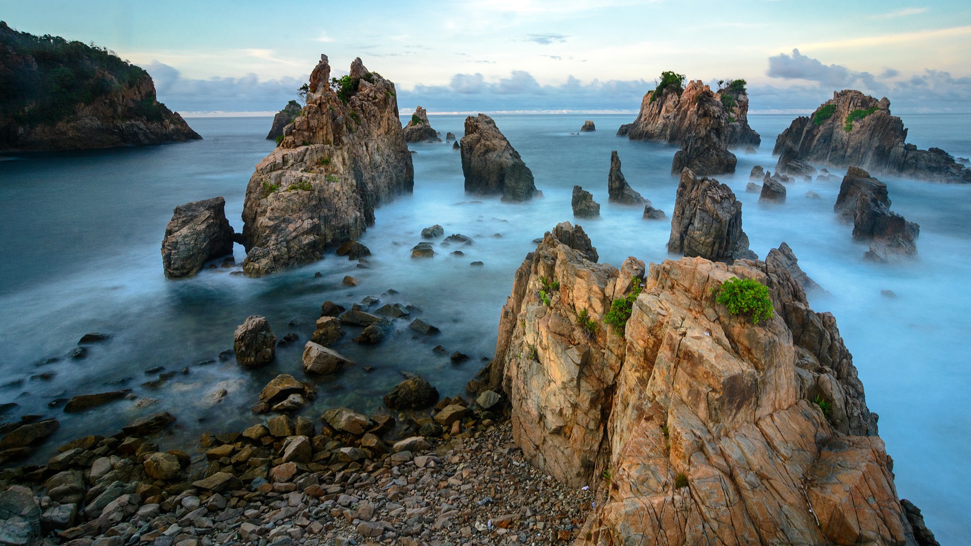 Gigi Hiu rock formation at Kelumbayan beach, Lampung, Sumatra, Indonesia. Windows 10 Spotlight Image