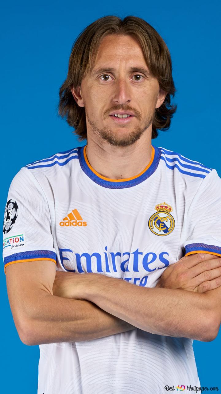 Luka Modric, Croatian national football player of Real Madrid, clasped his hands in front of a blue background 2K wallpaper download