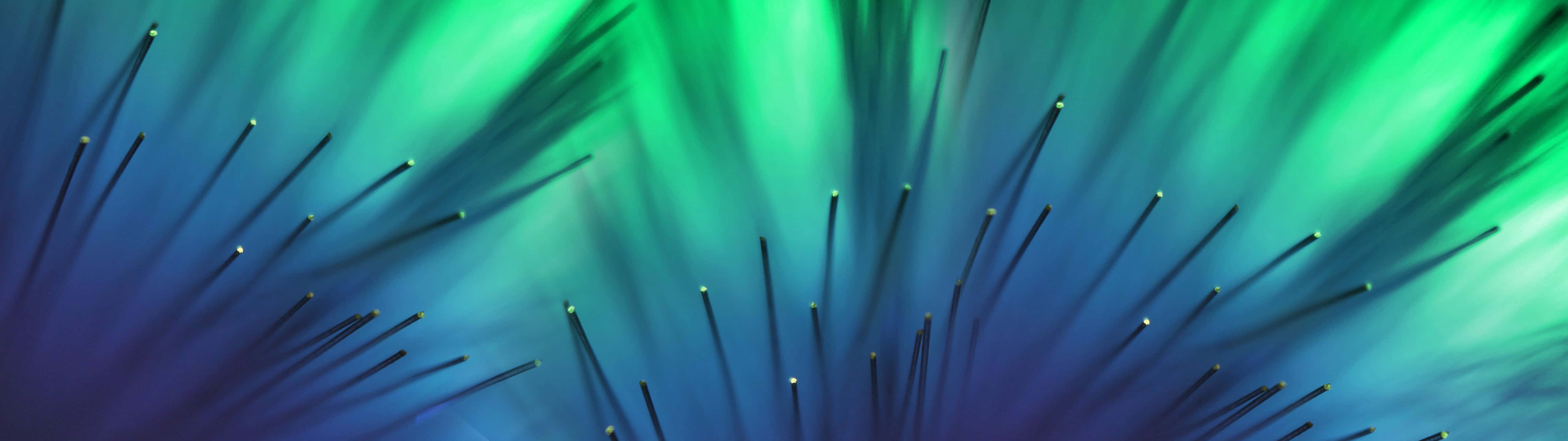 Download A Green And Blue Background With A Lot Of Spikes Wallpaper