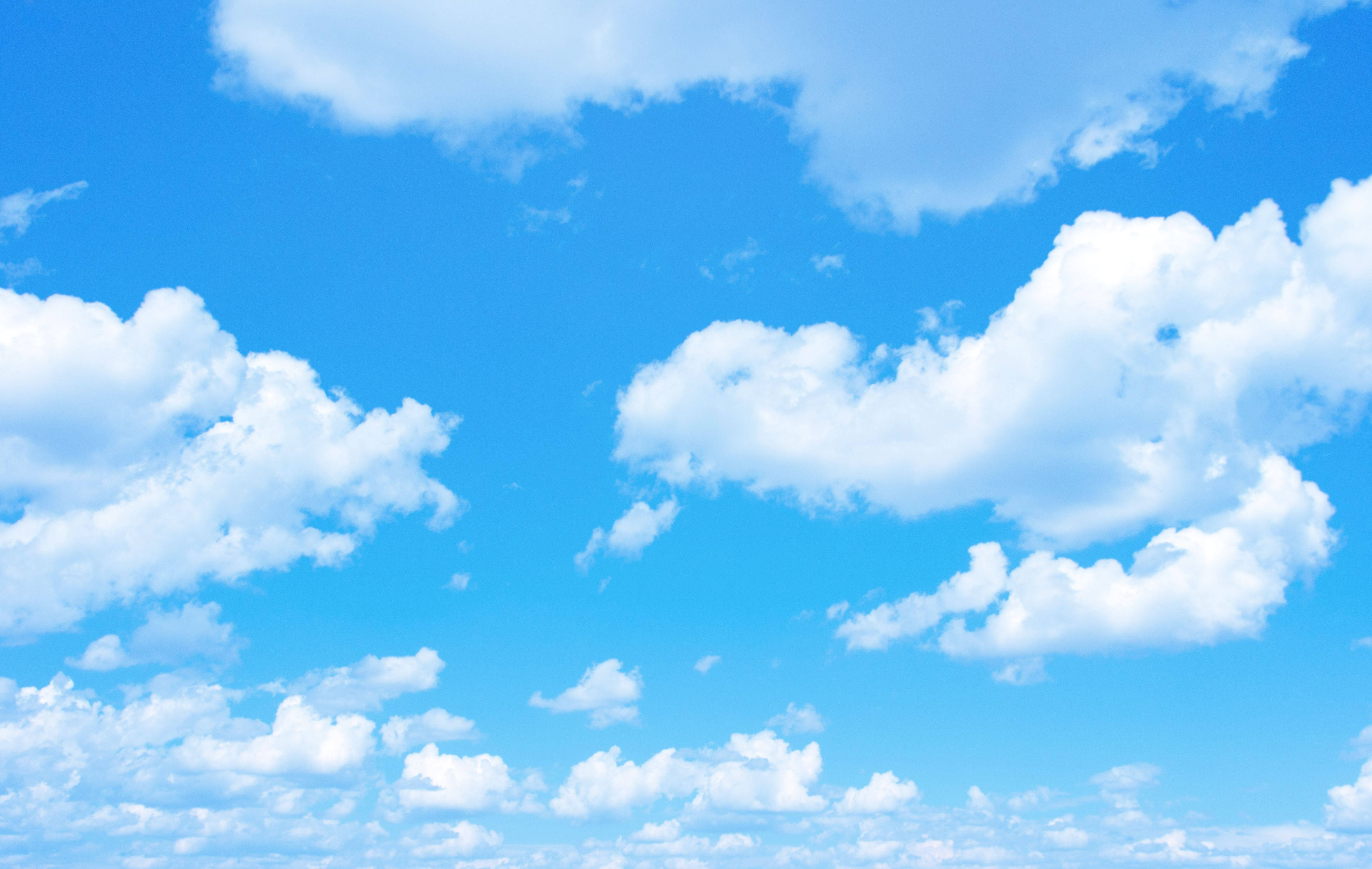 Download A Blue Sky With White Clouds Wallpaper