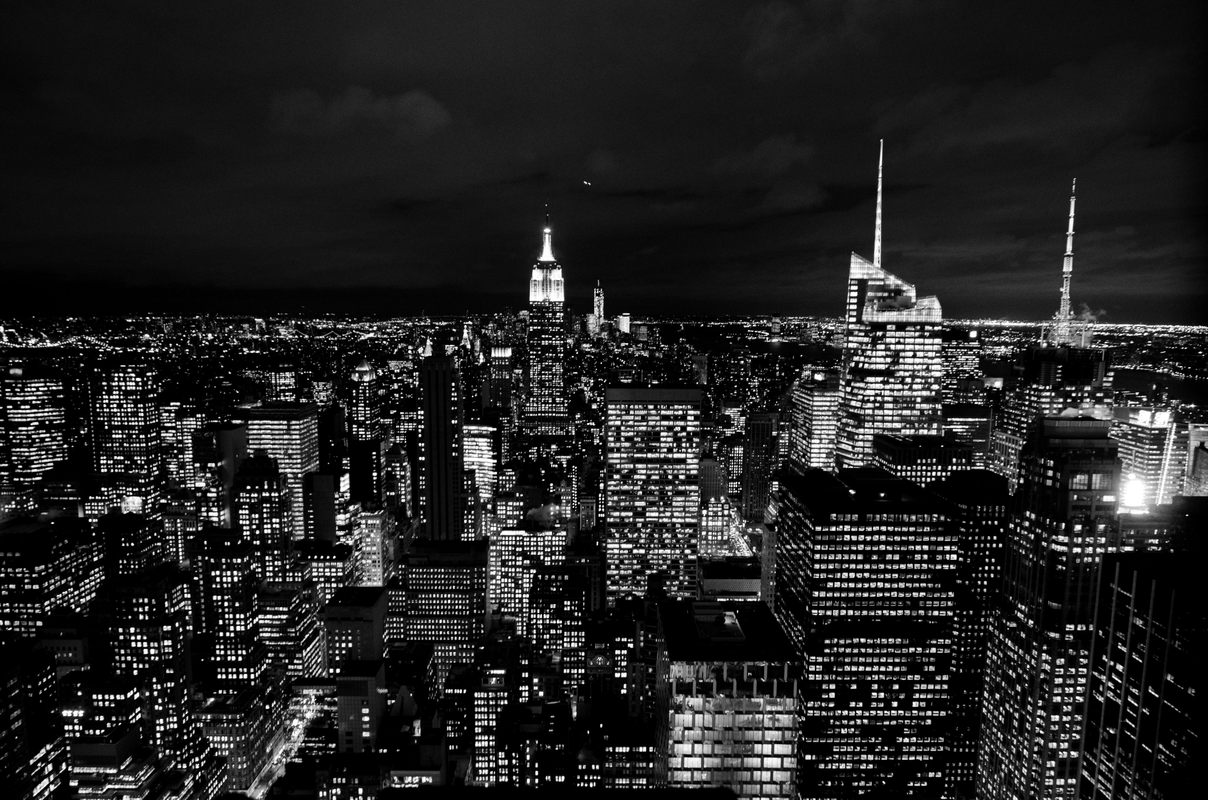 Wallpaper / black and white photo of the new york city skyscraper lights at night, city of stars 4k wallpaper free download