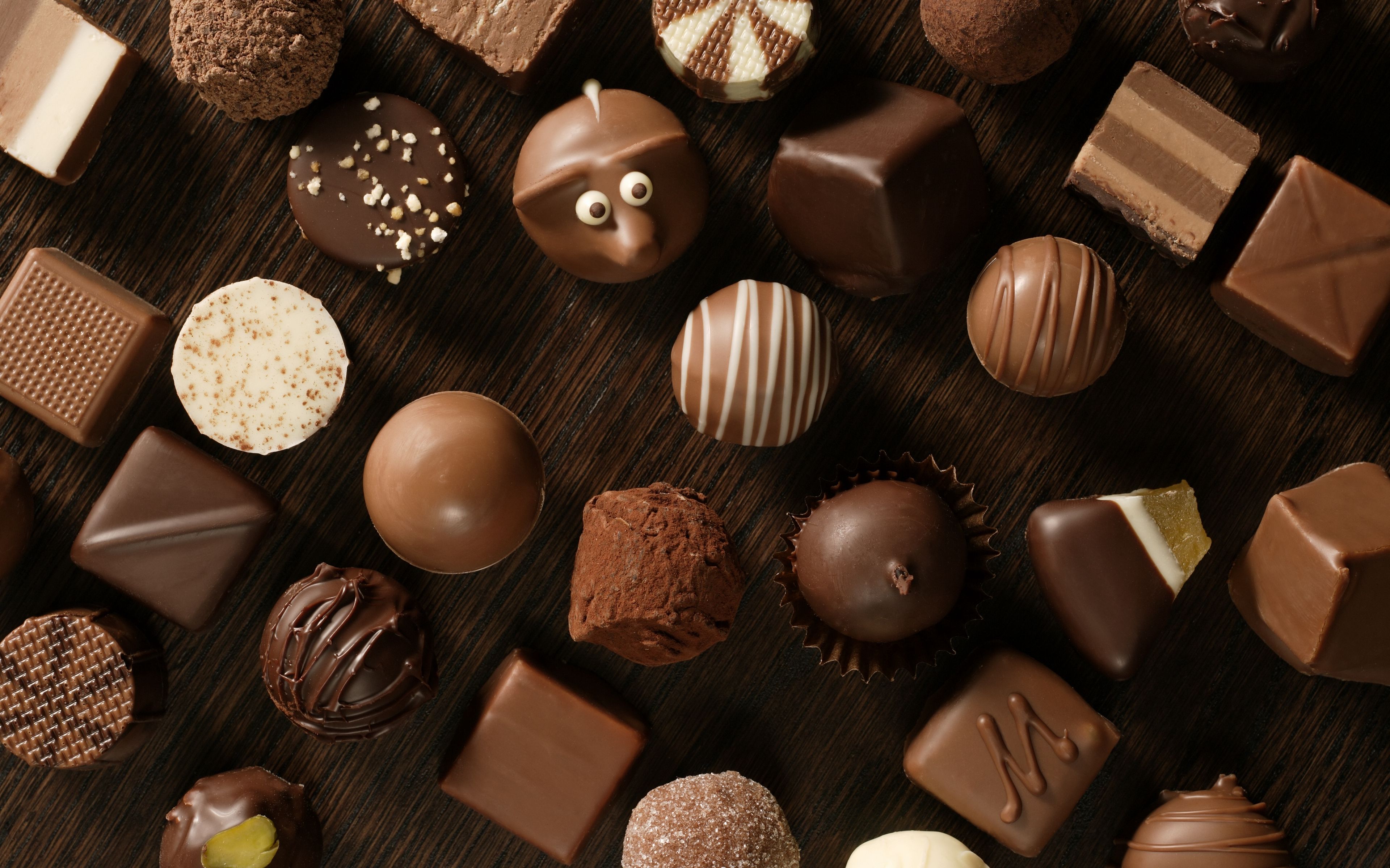 Download wallpaper 3840x2400 chocolate, candies, table, allsorts, eyes 4k ultra HD 16:10 HD background