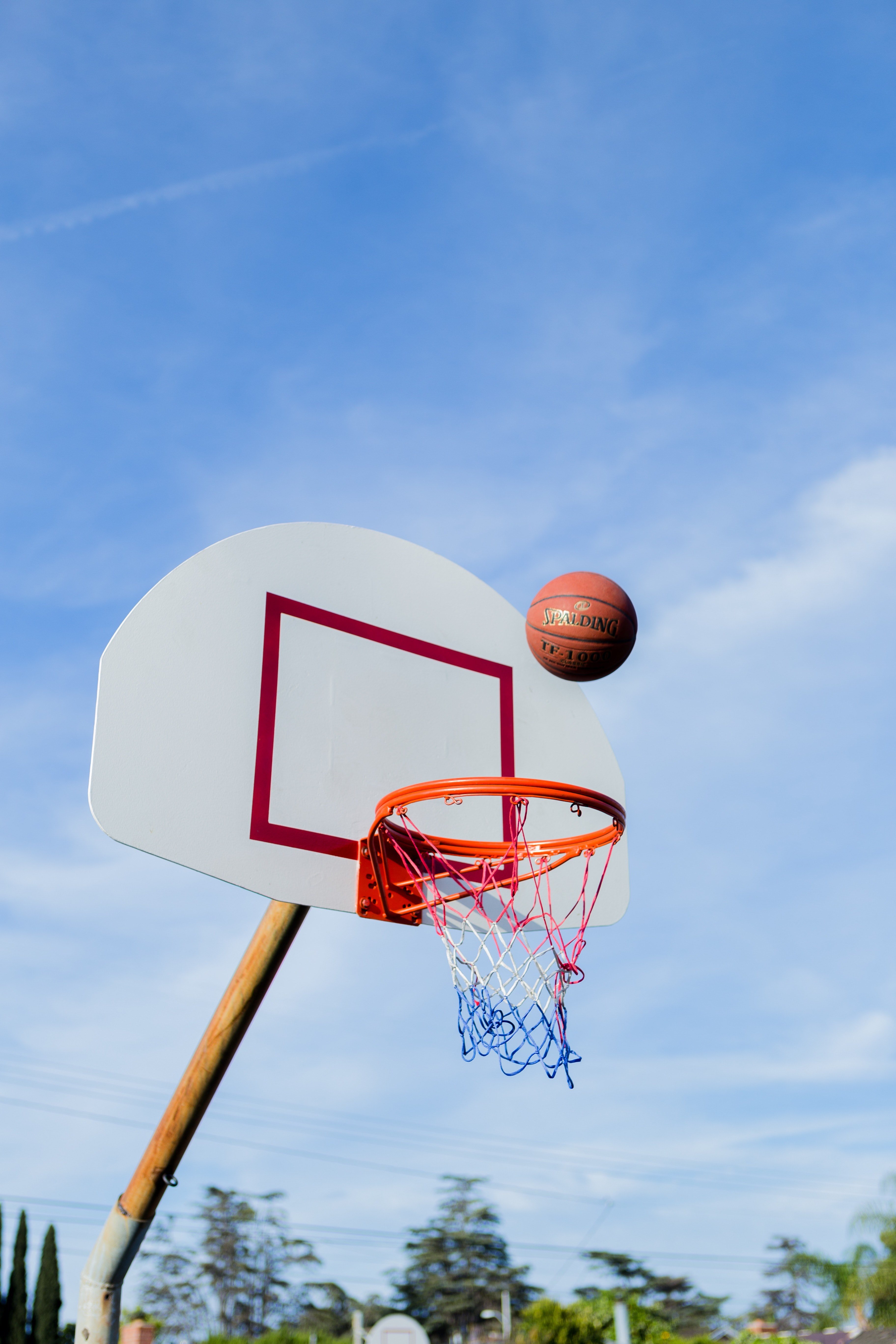 Wallpaper / a basketball about to enter a bball net in an outdoor court, _hoops 4k wallpaper free download