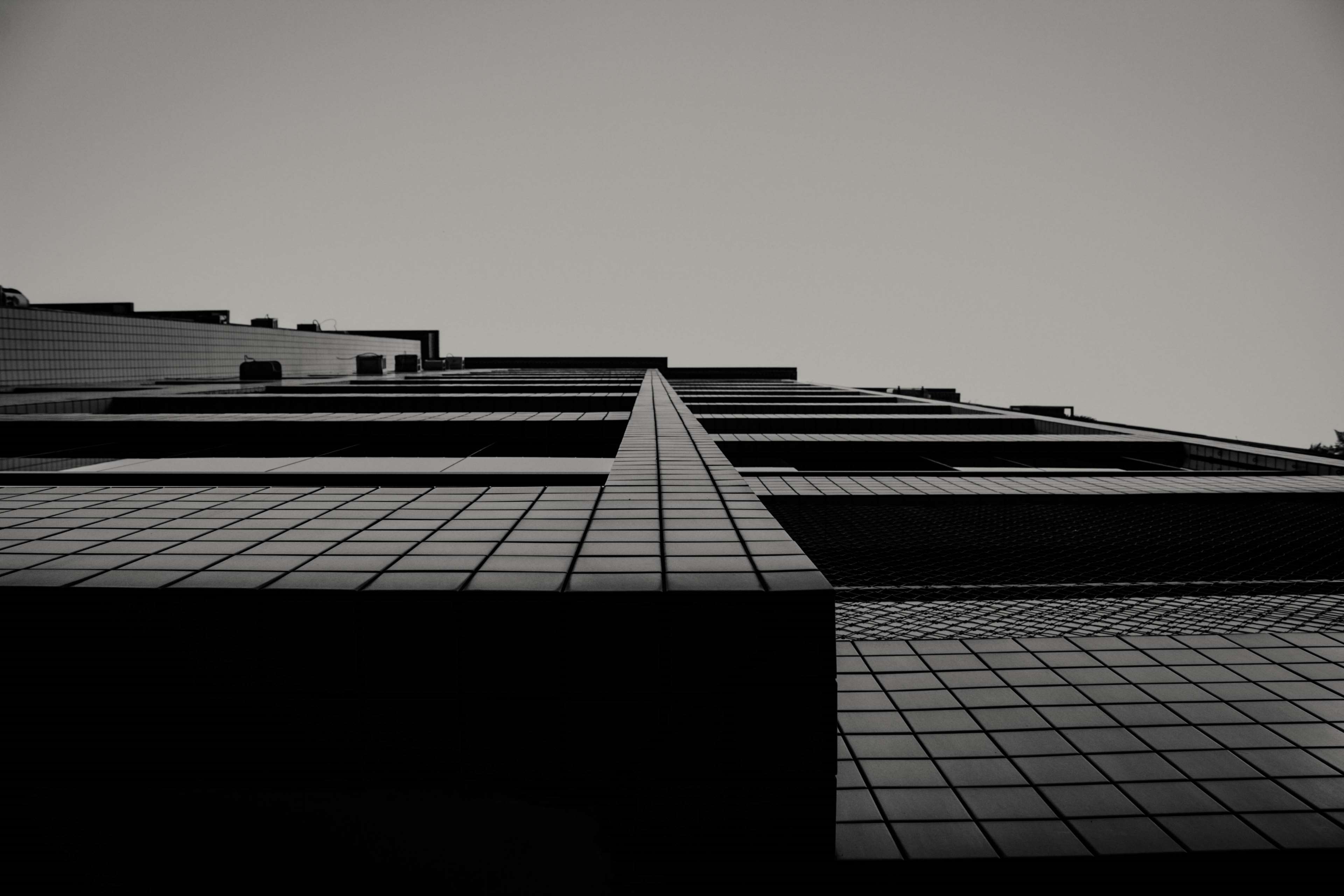 architecture, black and white, building, building exterior, low angle shot, perspective, sky 4k Gallery HD Wallpaper