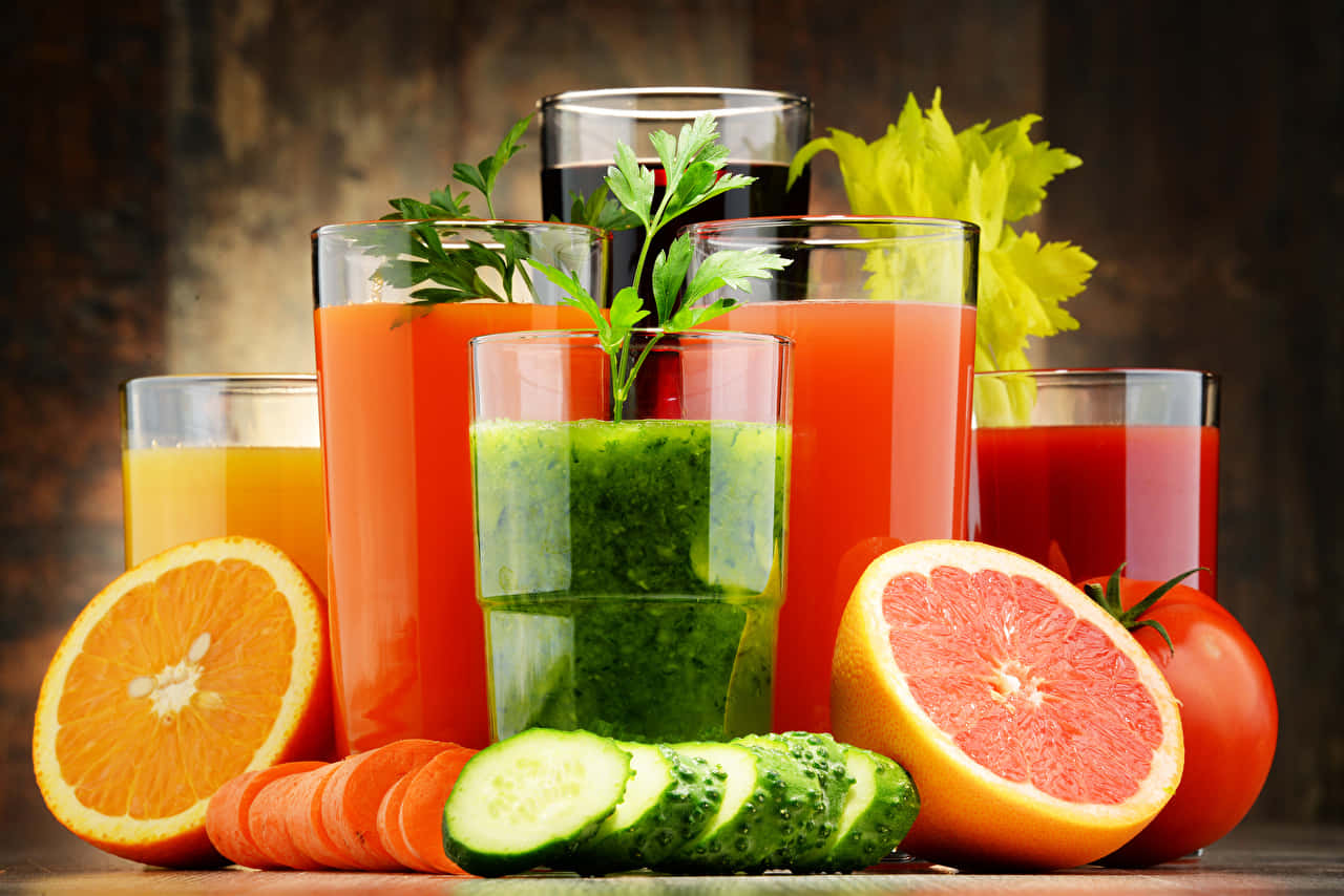 Download Juices And Fresh Fruit Slices Wallpaper