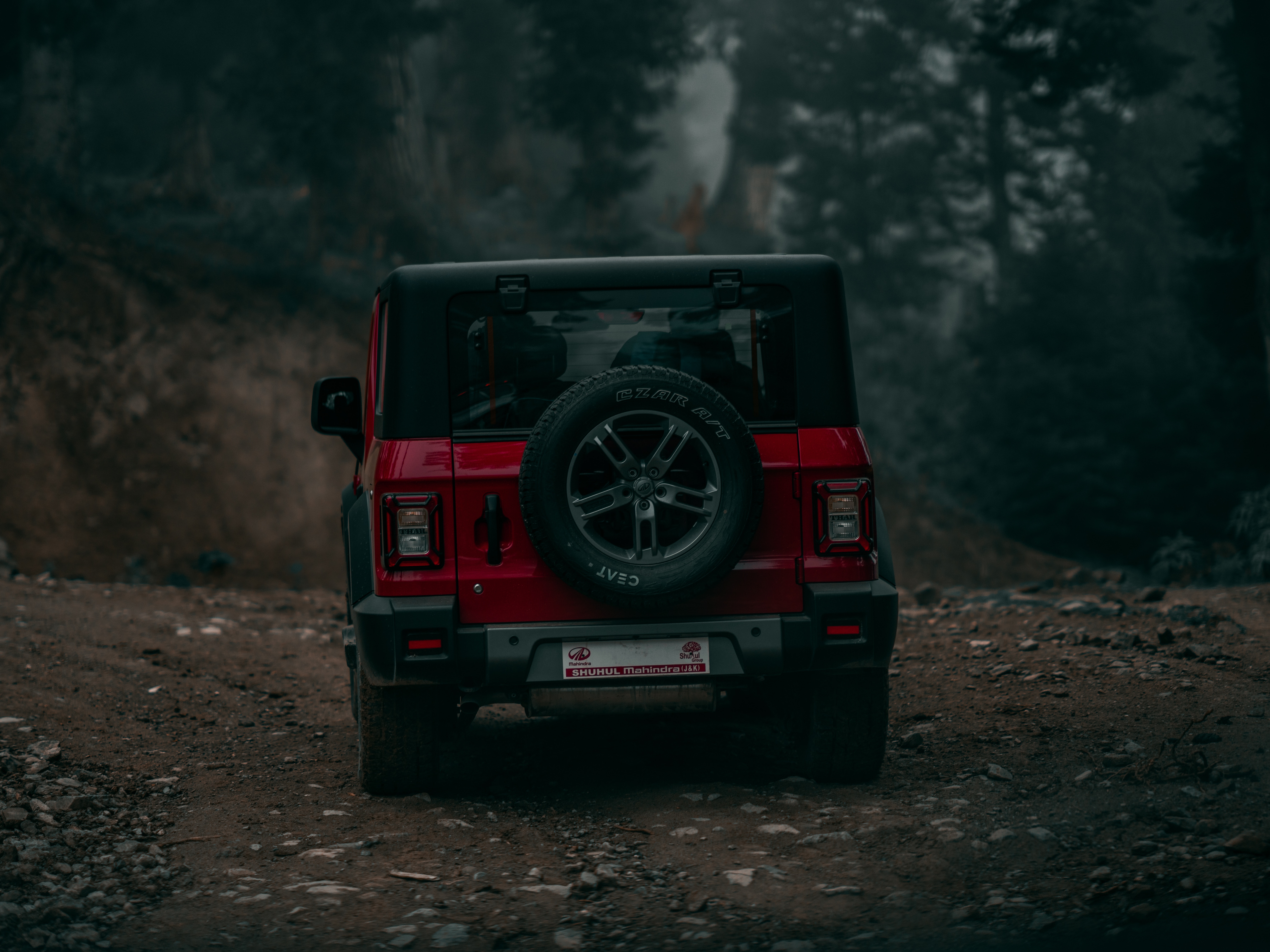 A Red Mahindra Thar on Dirt Road · Free