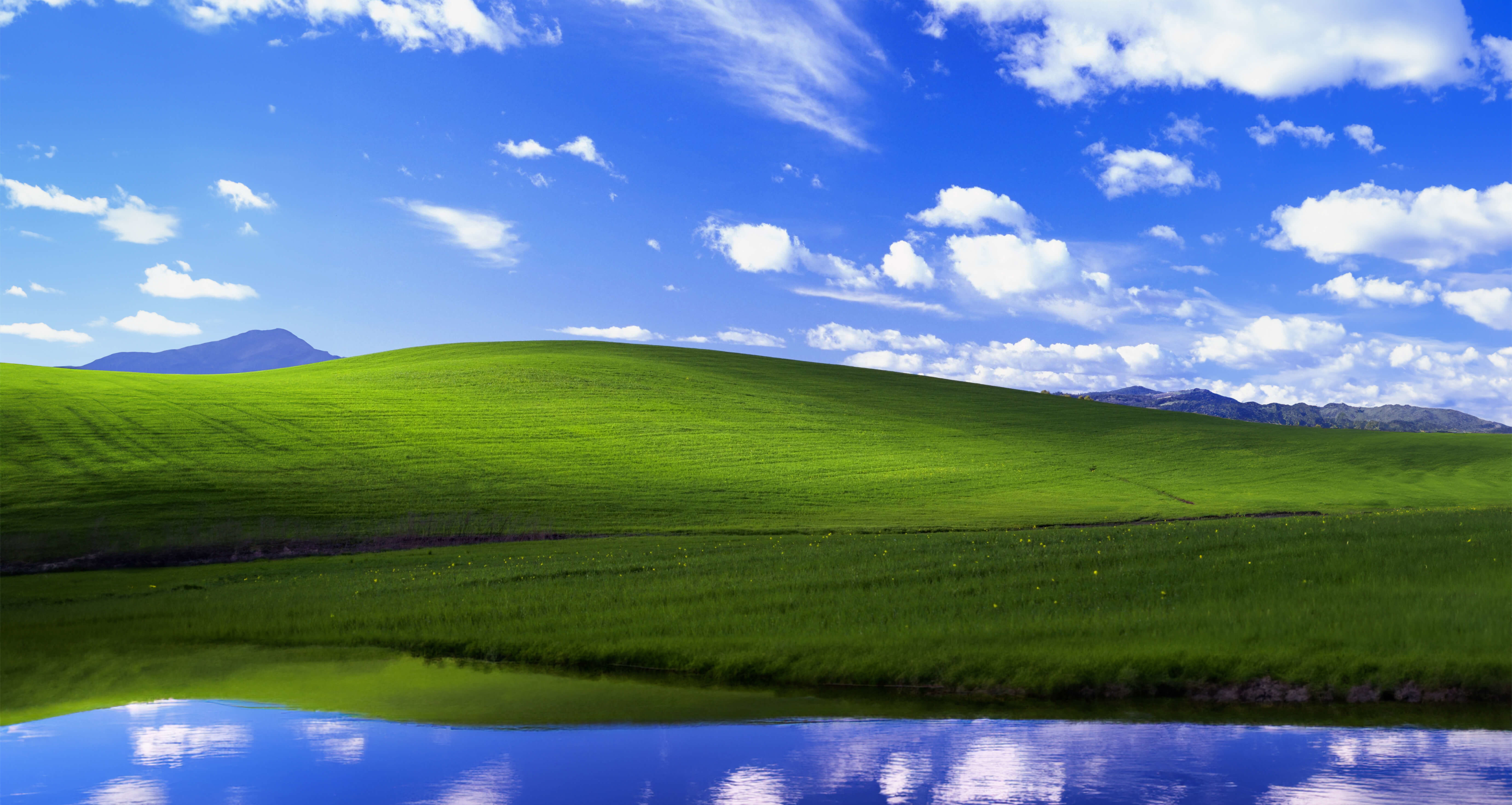 Check out the classic Windows XP and Windows 11 wallpaper with generative AI fill effects