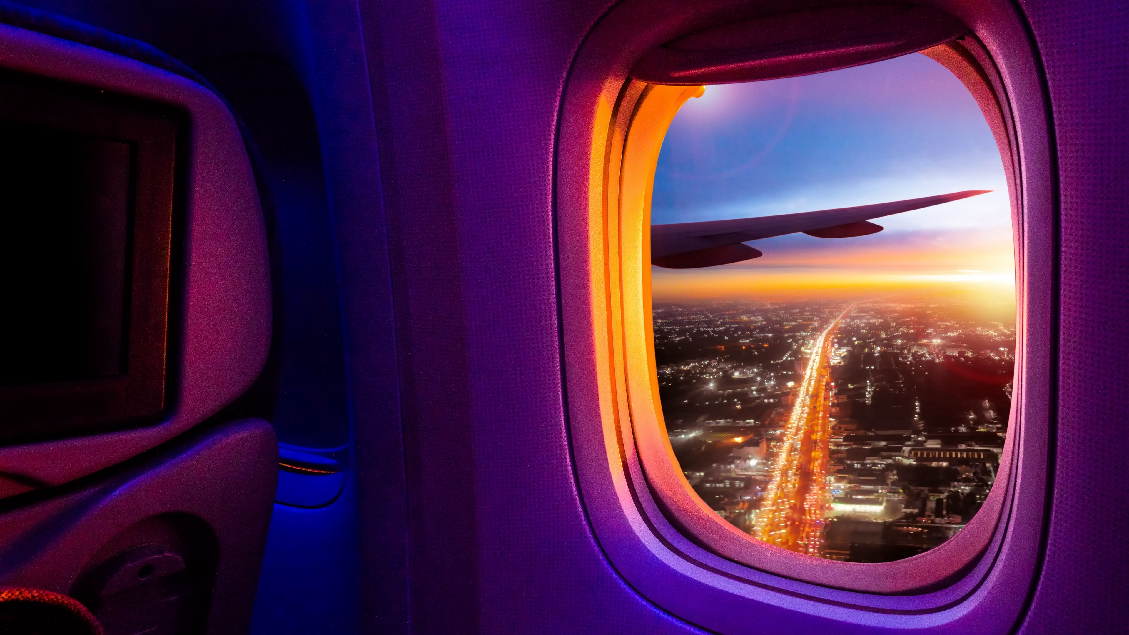 Wallpaper / airplane, porthole, window, overview, city, 4k free download