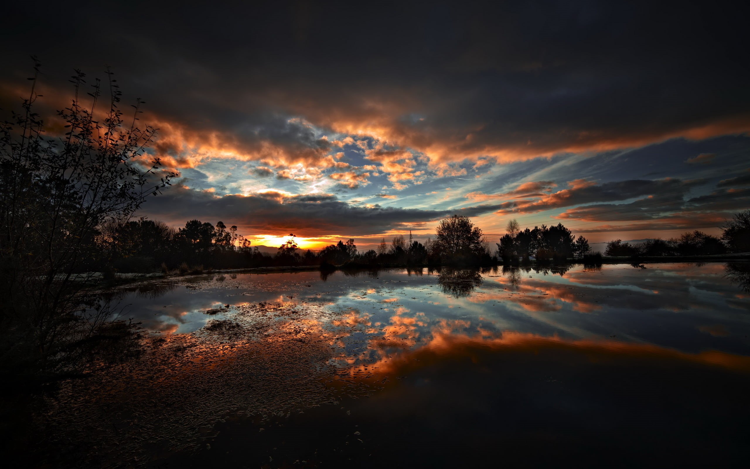 Wallpaper / 2K, sky, scenics, orange, tree, dramatic sky, no people, sunset, outdoors, dark, tranquility, idyllic, reflection, cloud, lakes, tranquil scene free download