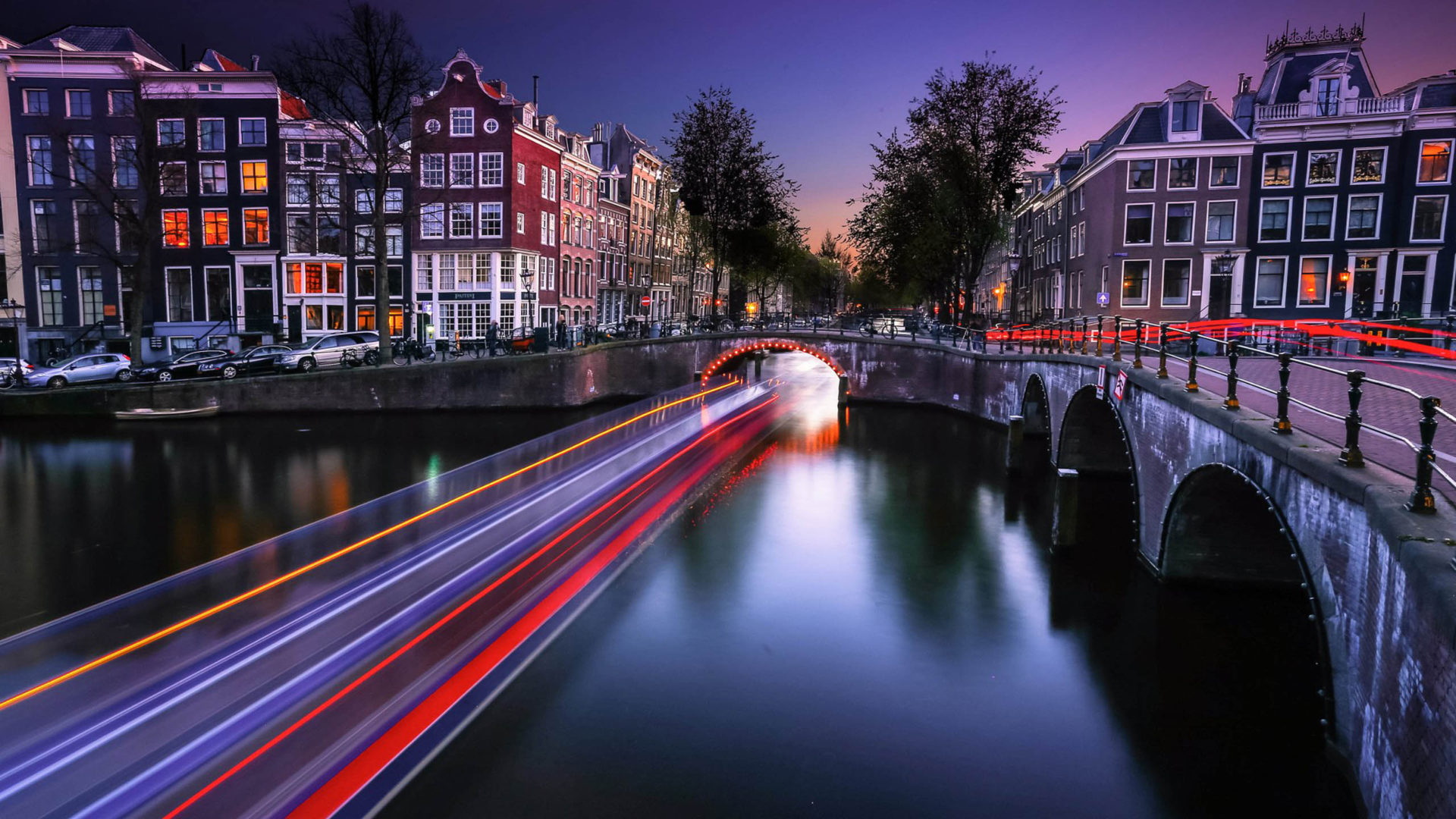 Cities Netherlands Amsterdam Night Time Houses Bridges River Channel Boat In Motion Desktop Wallpaper Background 2560x1600, Wallpaper13.com
