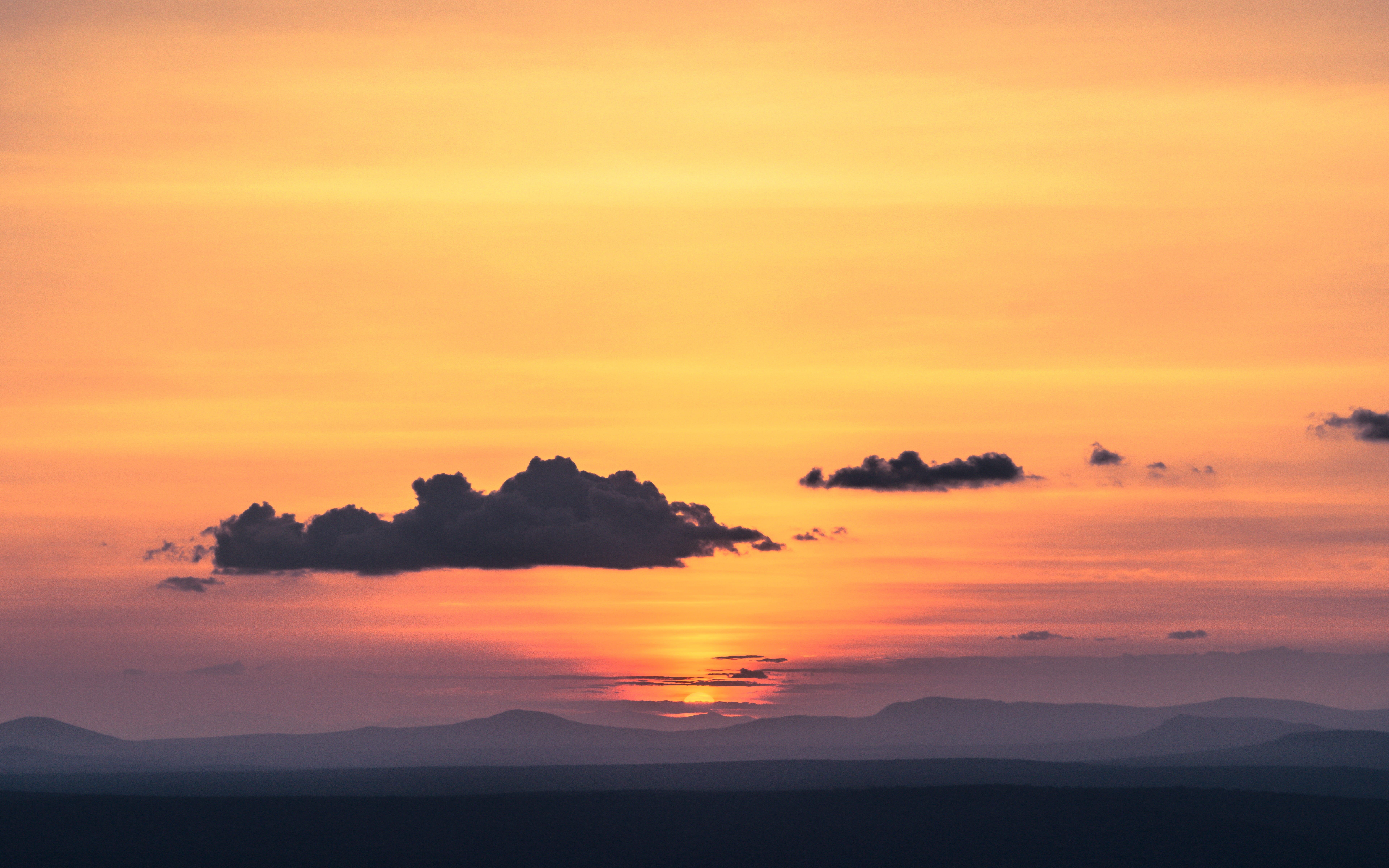Wallpaper / dramatic sky, golden, orange, person, scenic, summer, silhouette, adventure, natural, 8K, beauty in nature, panoramic, horizontal plane, sunlight, landscape free download