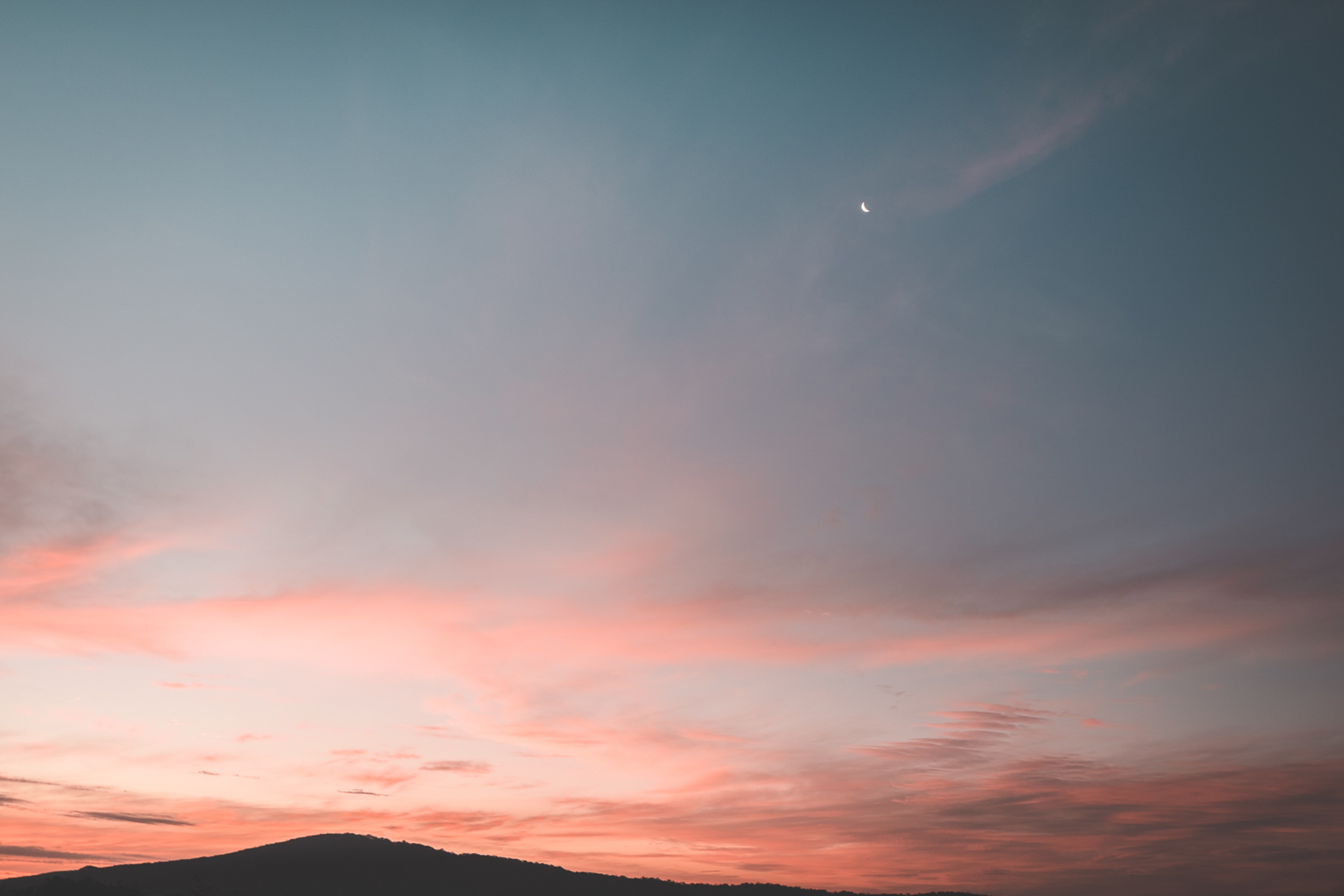 African woman with book at sunset · Free
