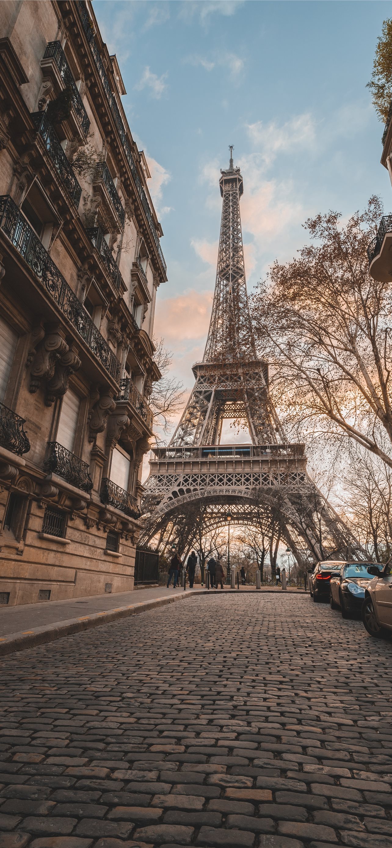 Eiffel Tower under blue sky during daytime iPhone 12 Wallpaper Free Download