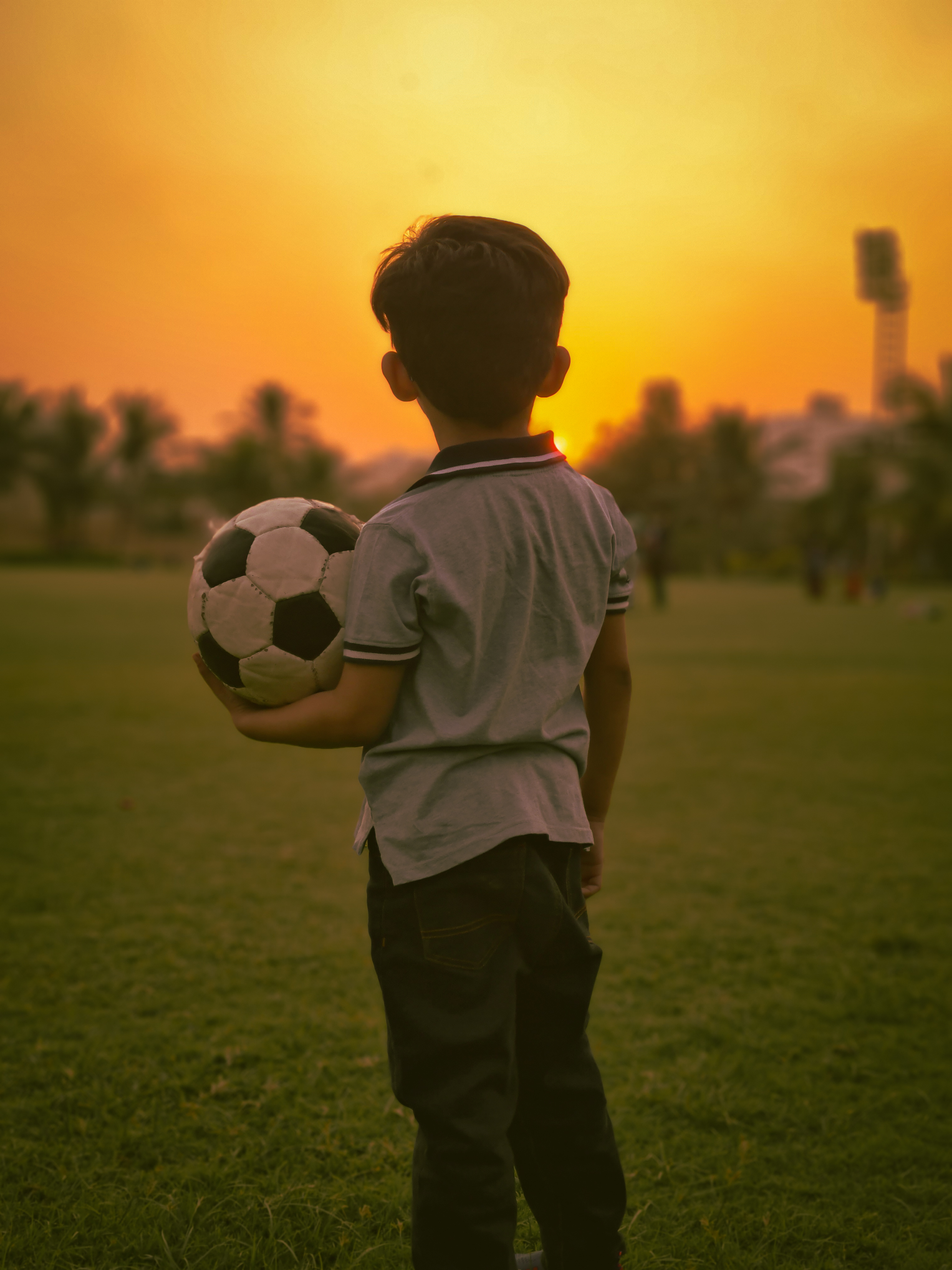A Boy Holding a Football · Free