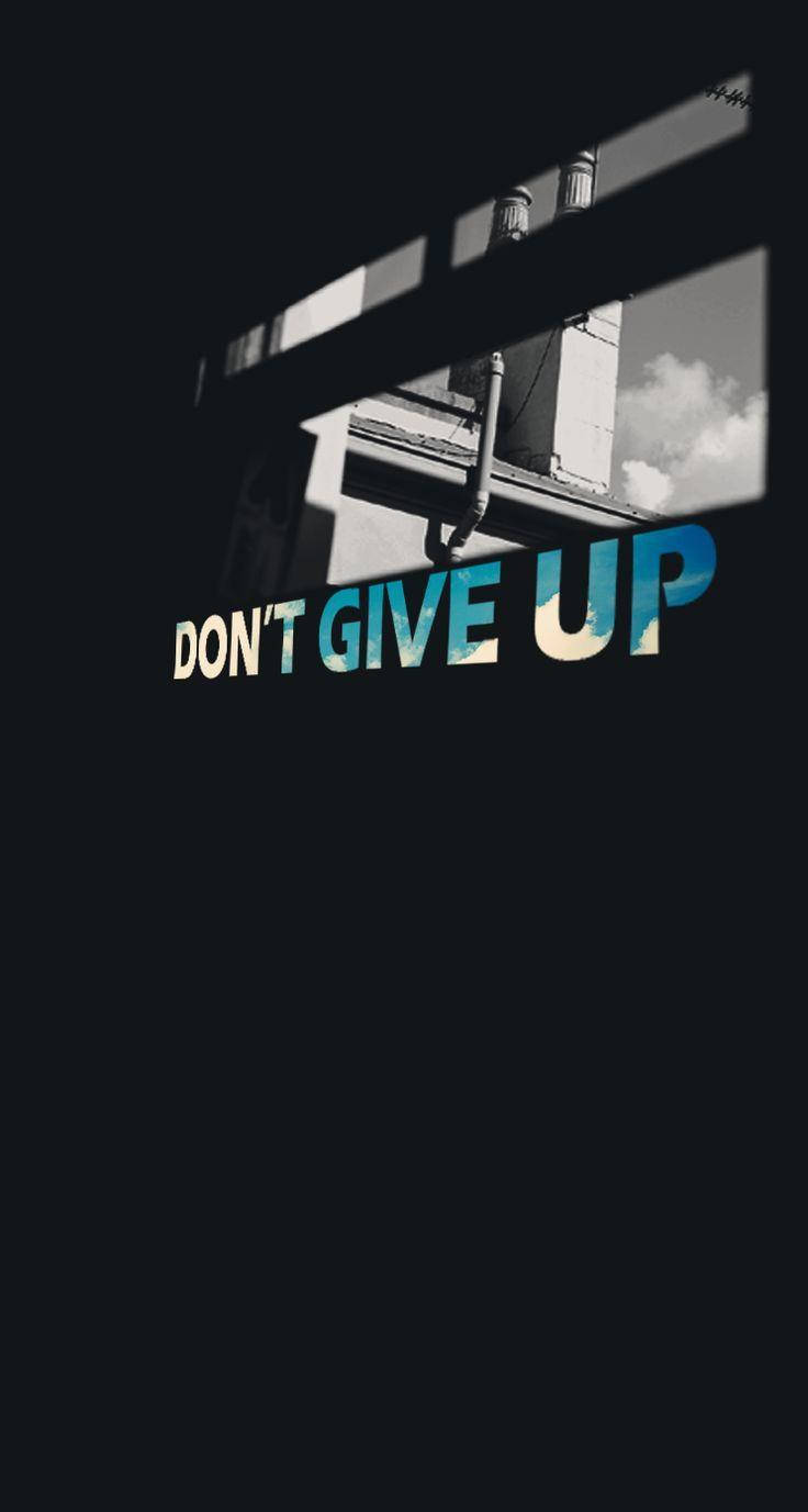 Download Inspiring Sky View with 'Never Give Up' Message Wallpaper