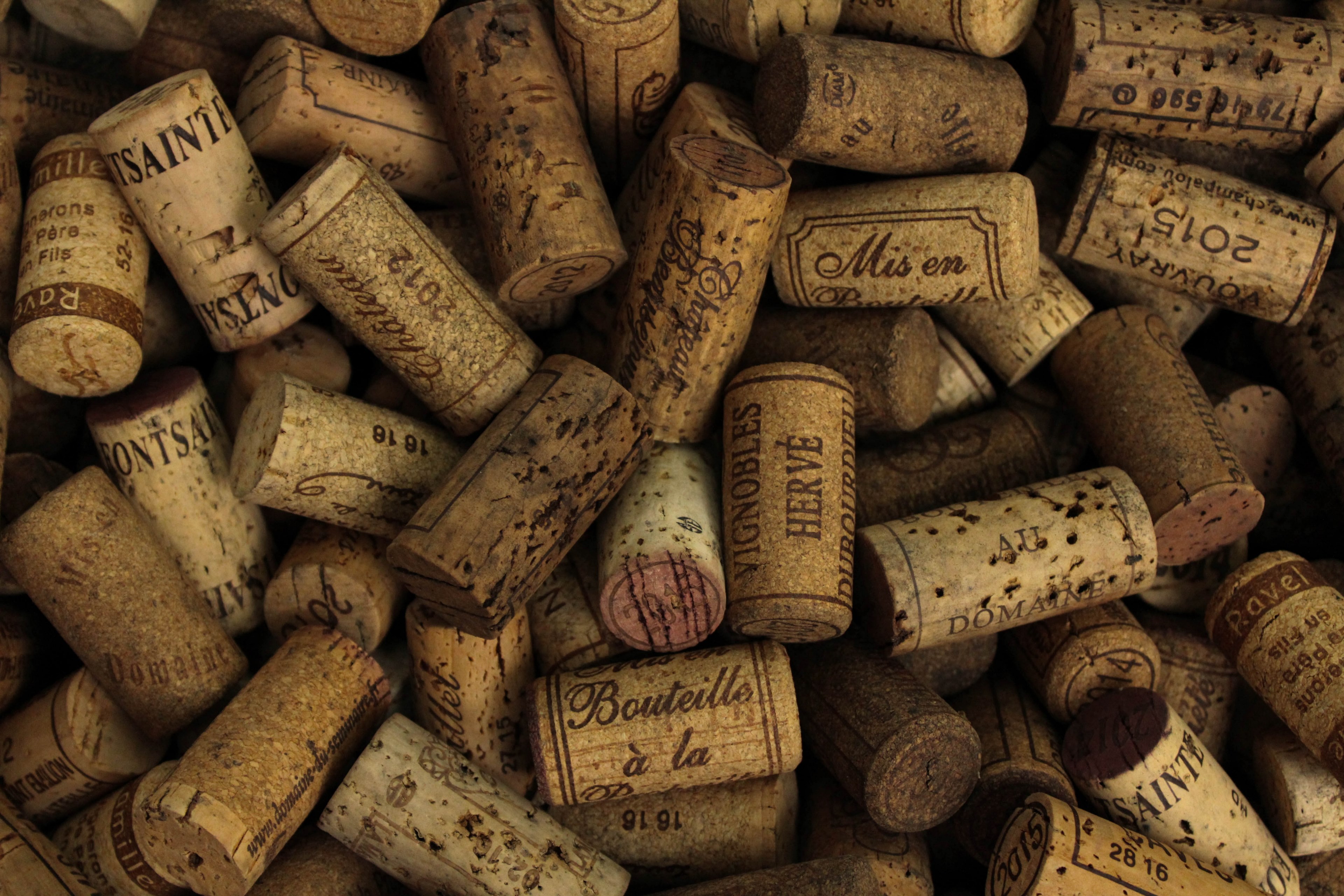 Wallpaper / a macro shot of a pile of wine bottle corks, _wine bottle corks 4k wallpaper free download
