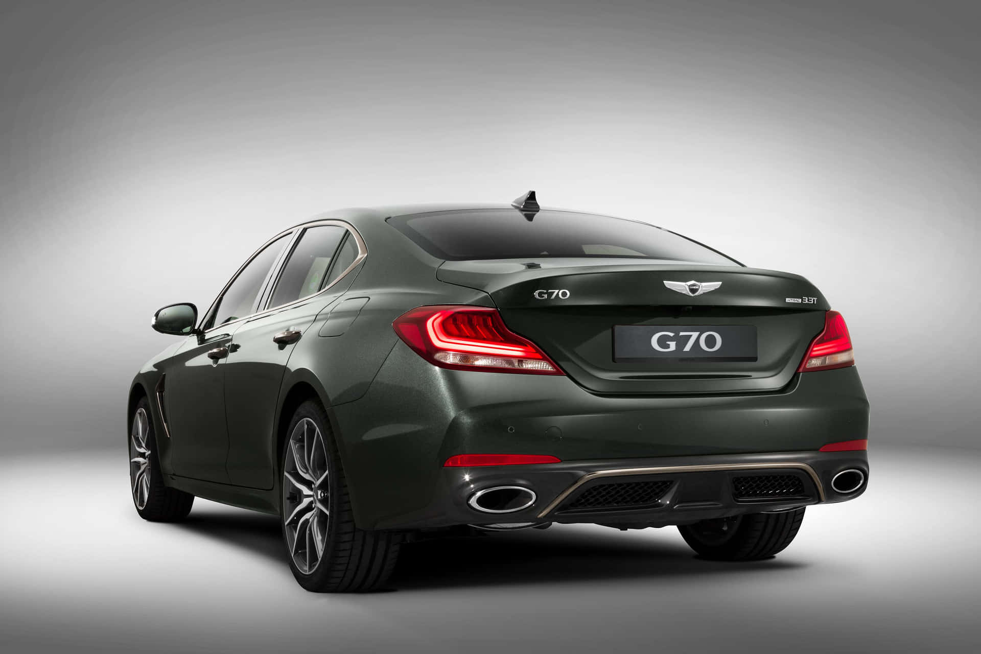 Download Sleek and Luxurious Genesis G70 on the Open Road Wallpaper