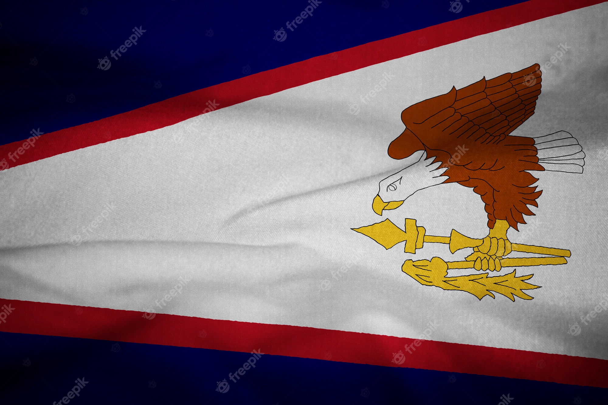 Premium Photo. Ruffled flag of american samoa blowing in wind