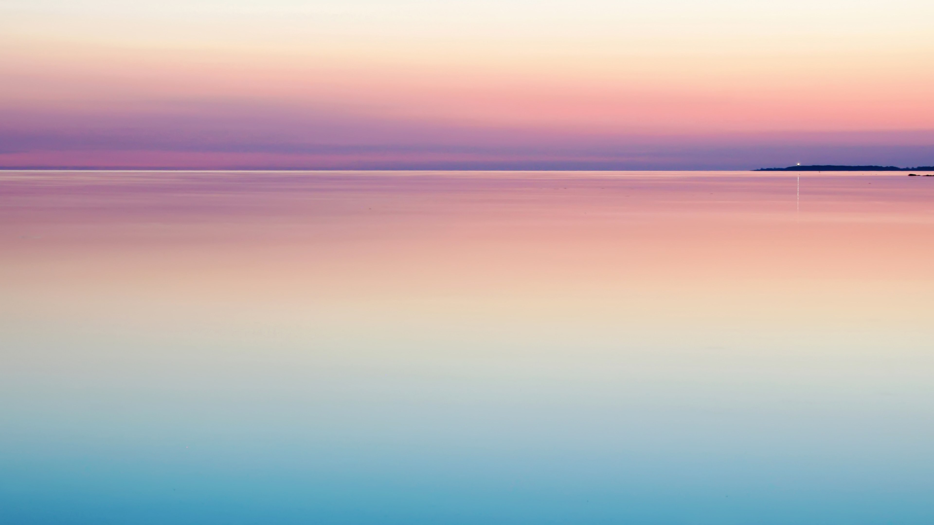 Wallpaper / a peaceful and serene pastel pink and purple sunset reflecting on still and calm water, sunset water sea and colorful HD 4k wallpaper free download