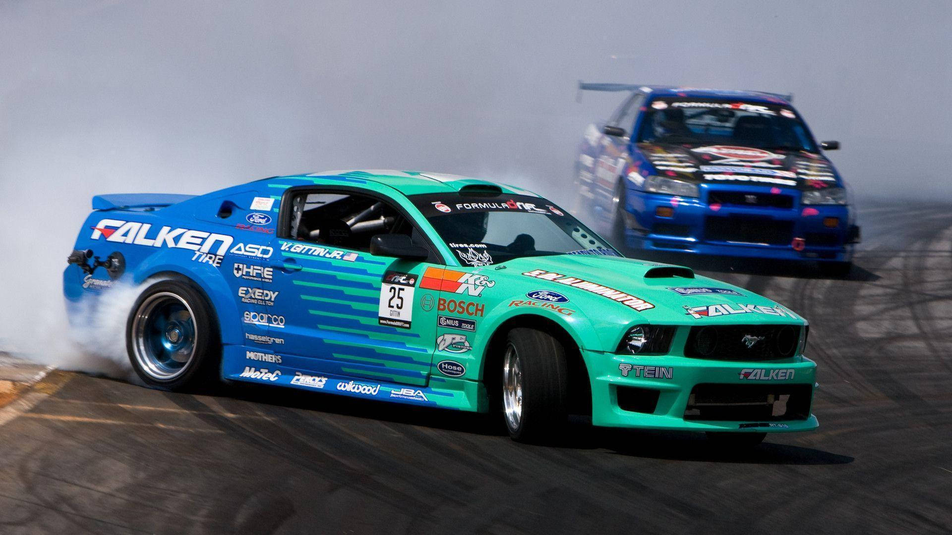 Download Blue And Green Drift Cars Wallpaper