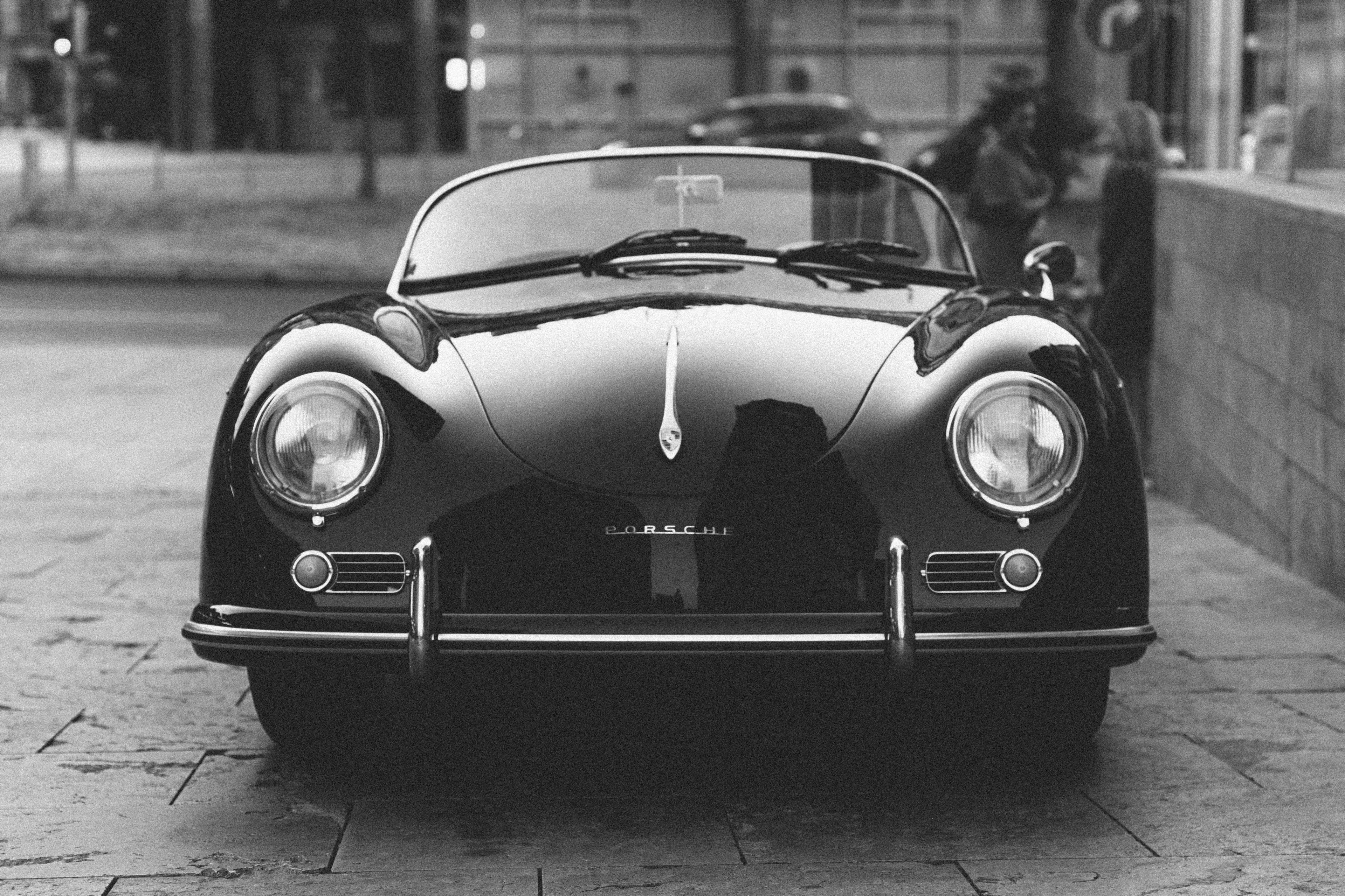 Wallpaper / a black and white shot of a classic car in a retro setting, classic convertible car 4k wallpaper free download
