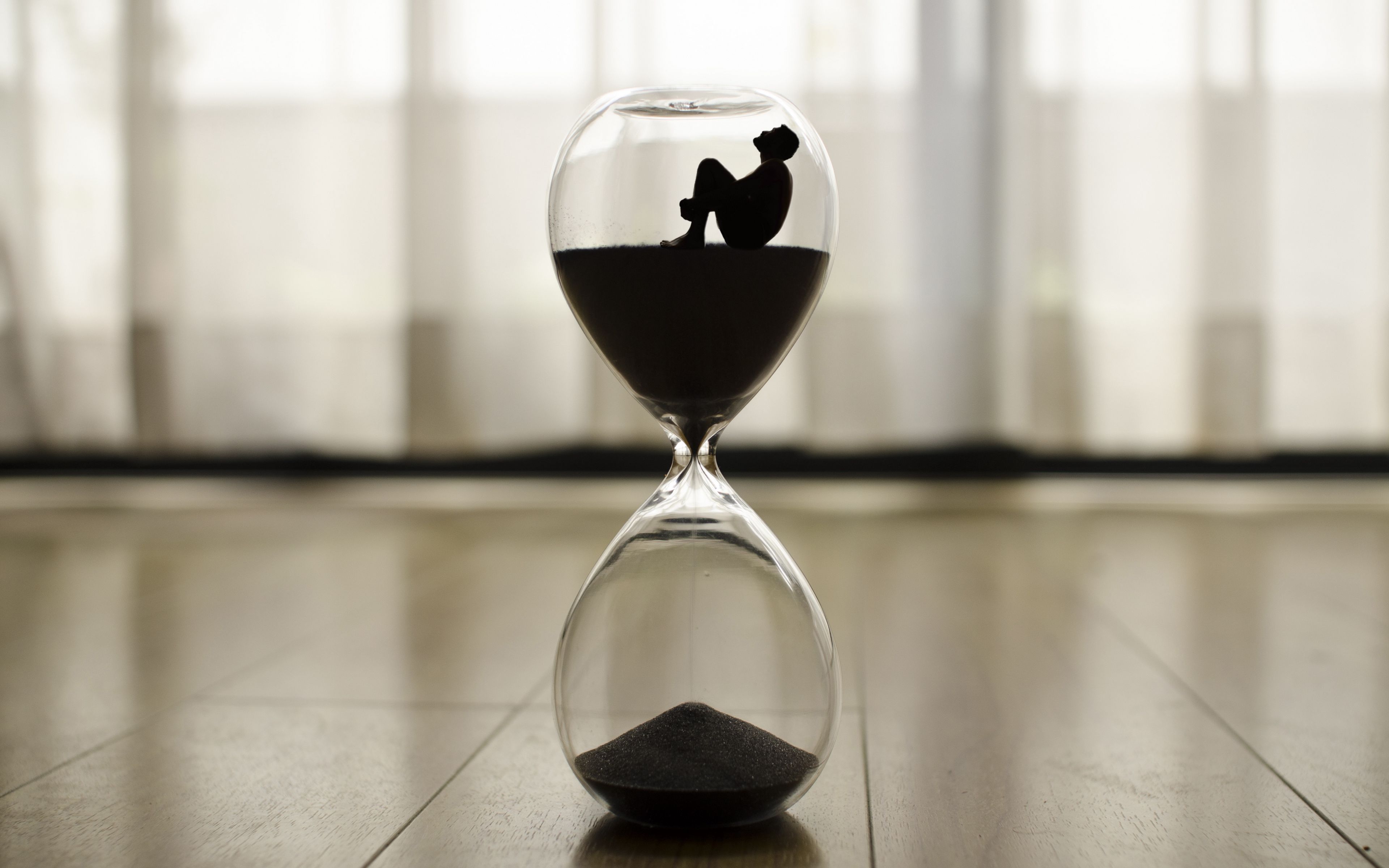 Download wallpaper 3840x2400 hourglass, man, time, loneliness 4k ultra HD 16:10 HD background