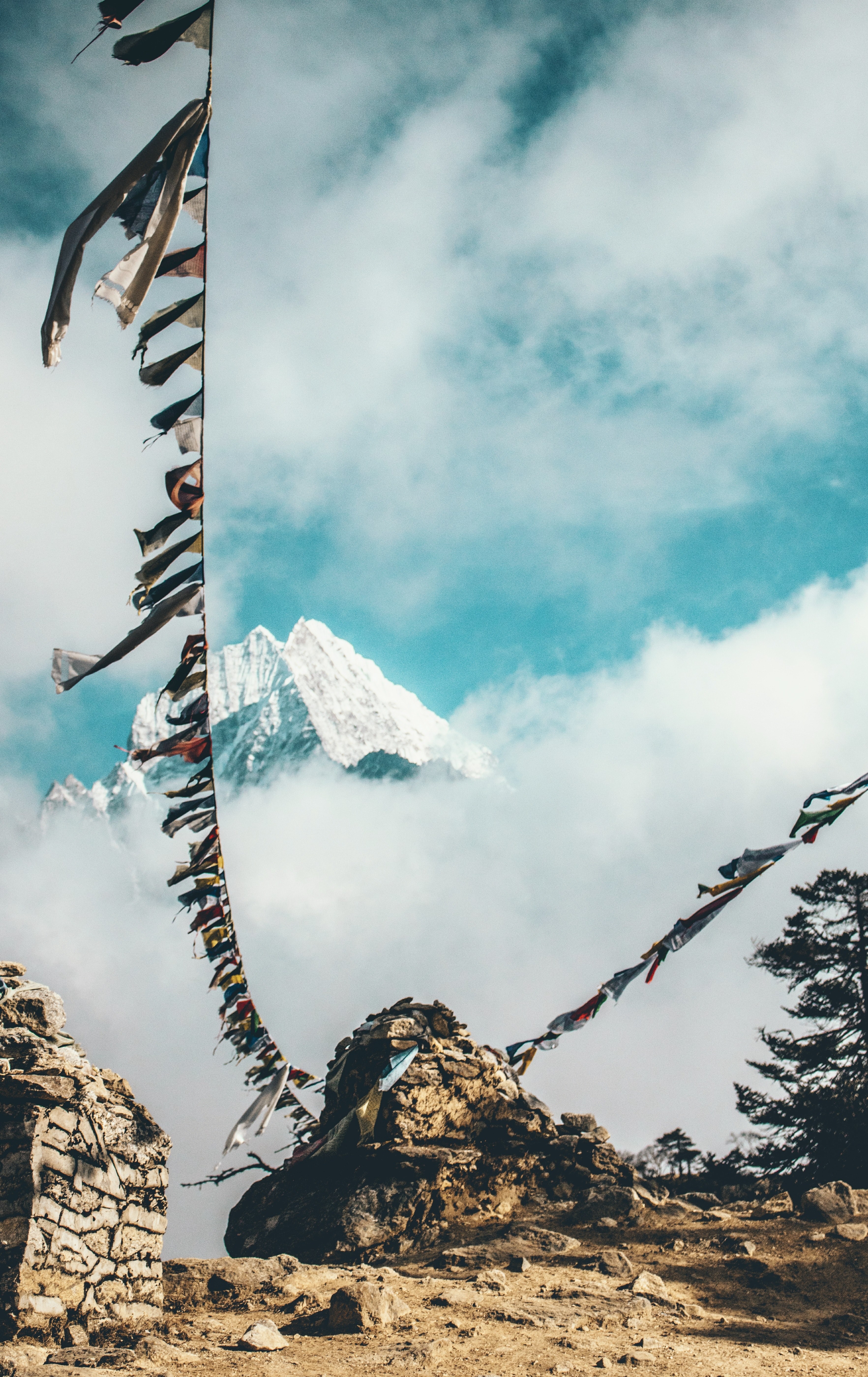 Wallpaper / a long line with colorful flags in tall mountains in nepal, fluttering dreams 4k wallpaper free download