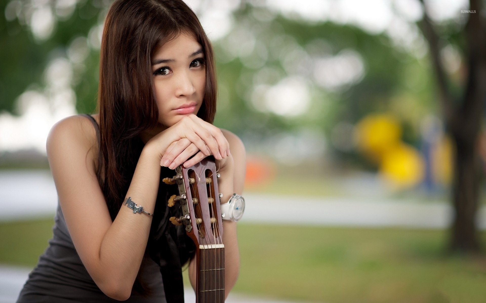 Sad asian girl with a guitar wallpaper wallpaper