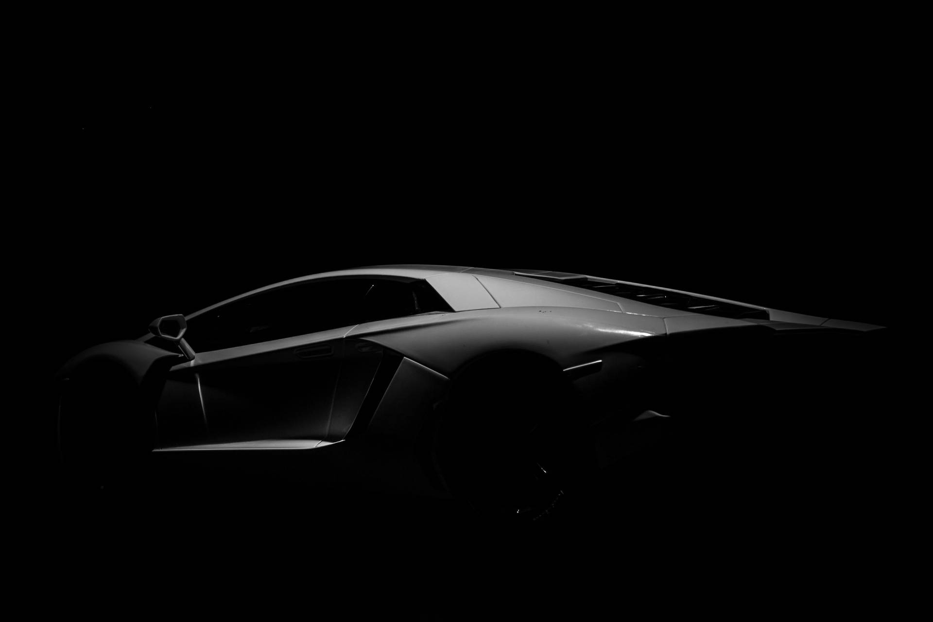 Download Black Sports Cars In The Dark Wallpaper