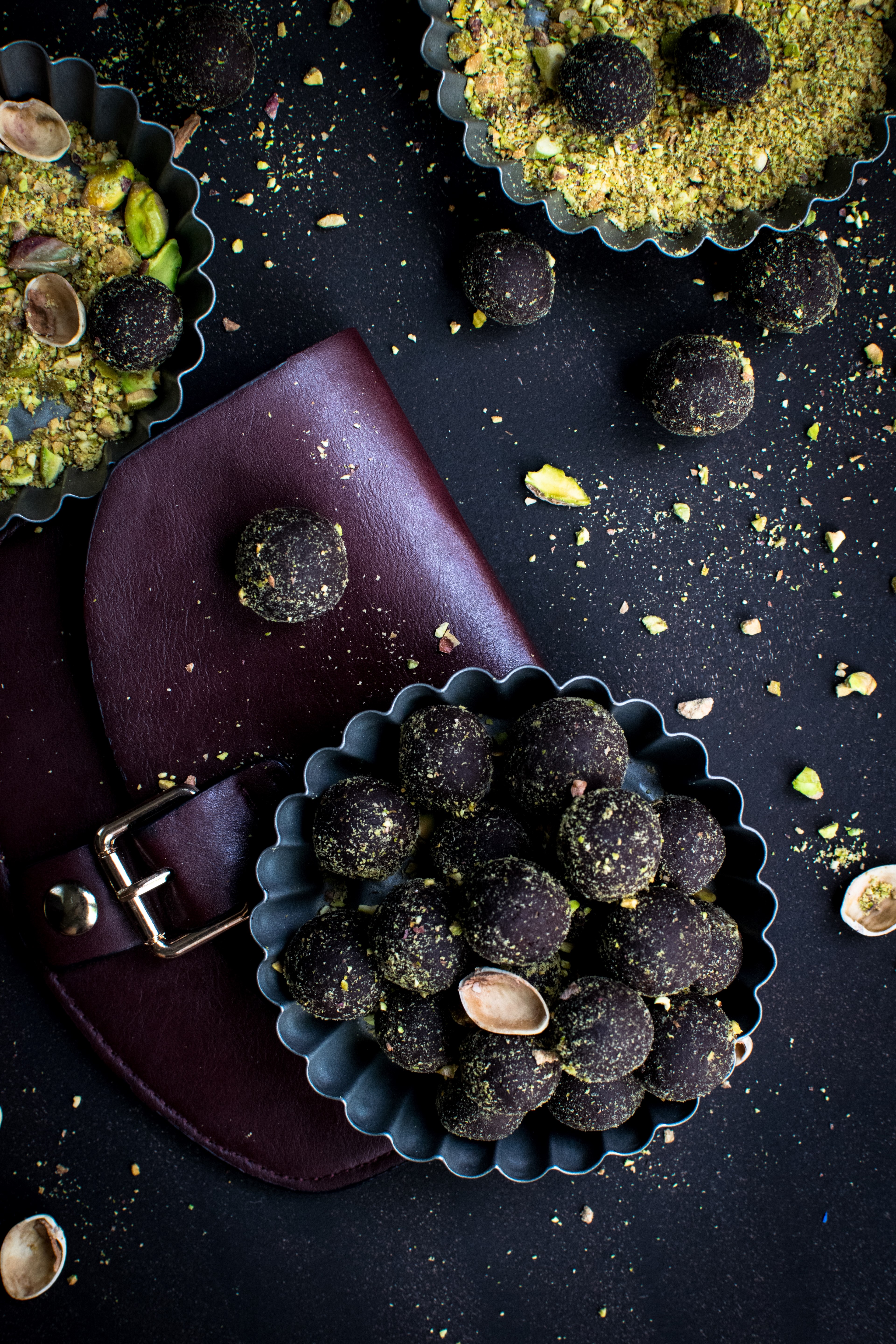 Wallpaper / dark chocolate pralines with pistachios 4k wallpaper free download