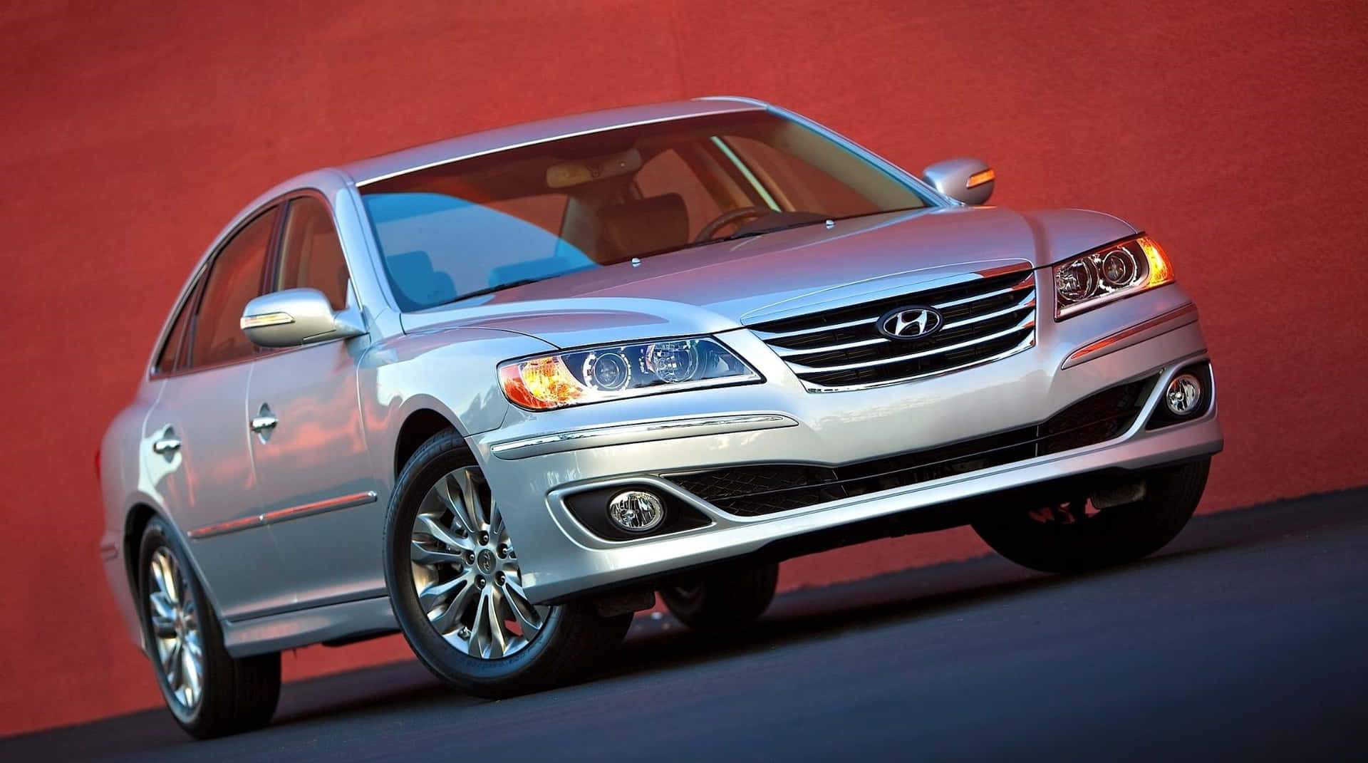 Download Sleek Silver Hyundai Azera Cruising on a Serene Country Road Wallpaper