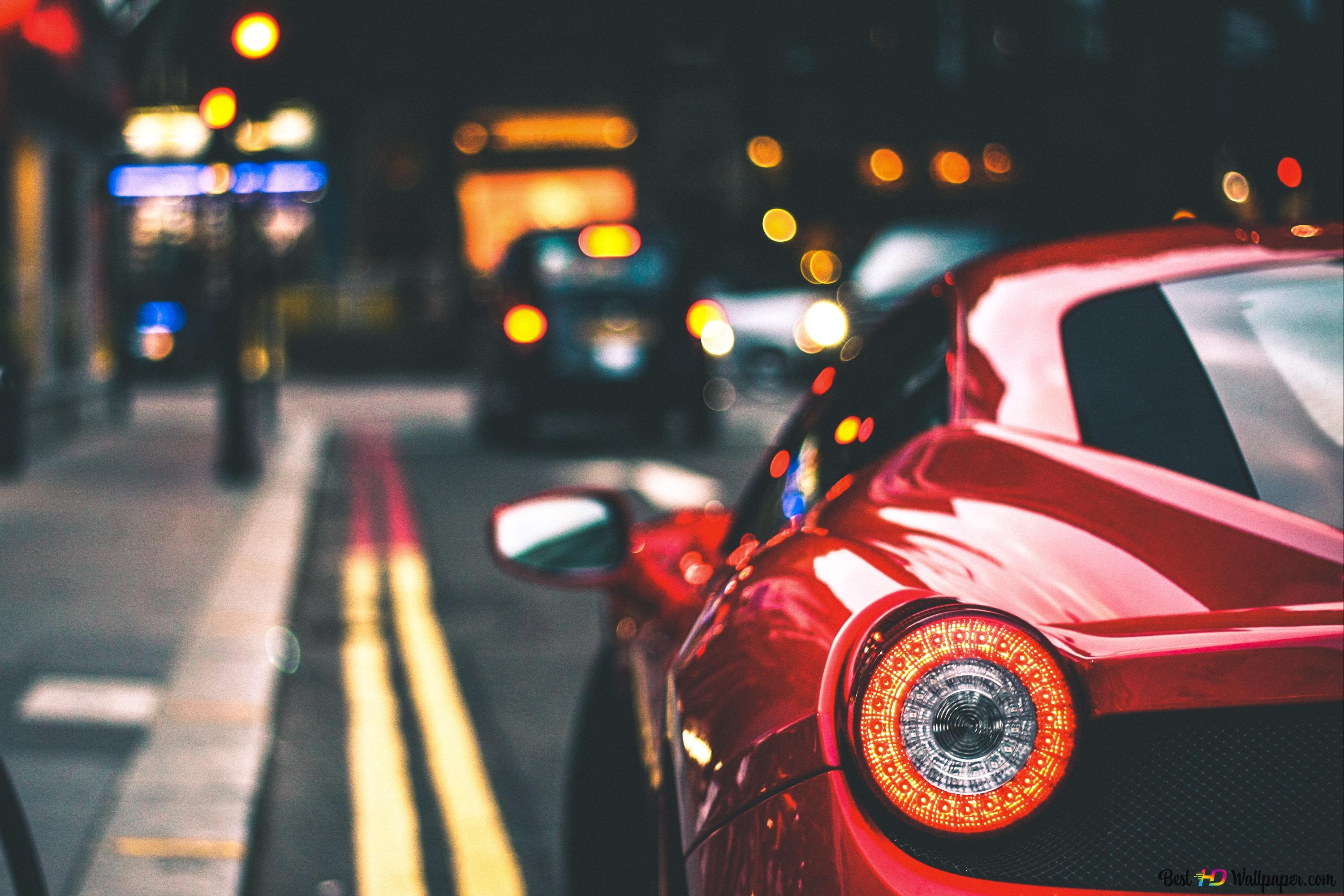 Red sport car on street 4K wallpaper download