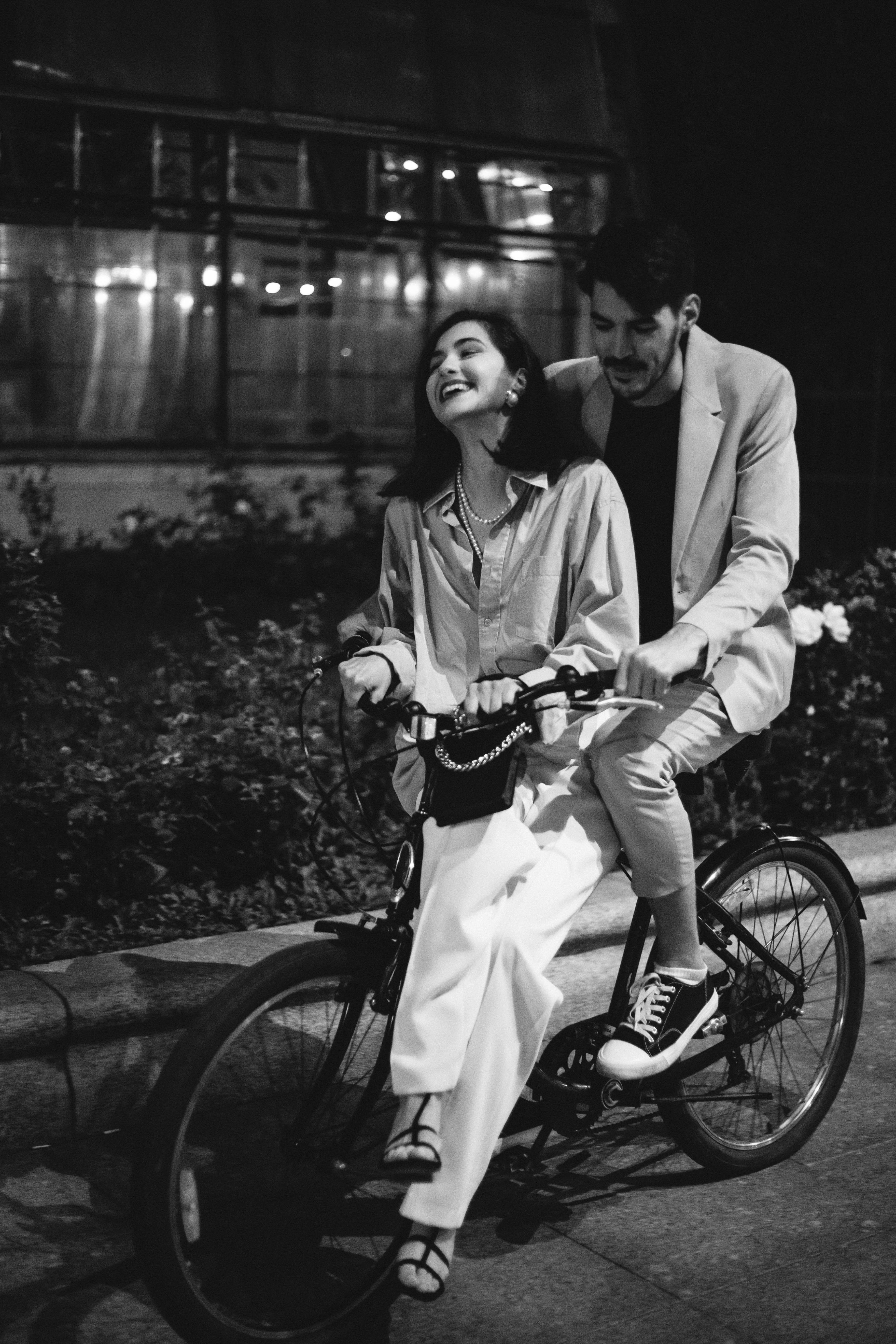 Black and White Photo of a Couple Riding a Bike · Free