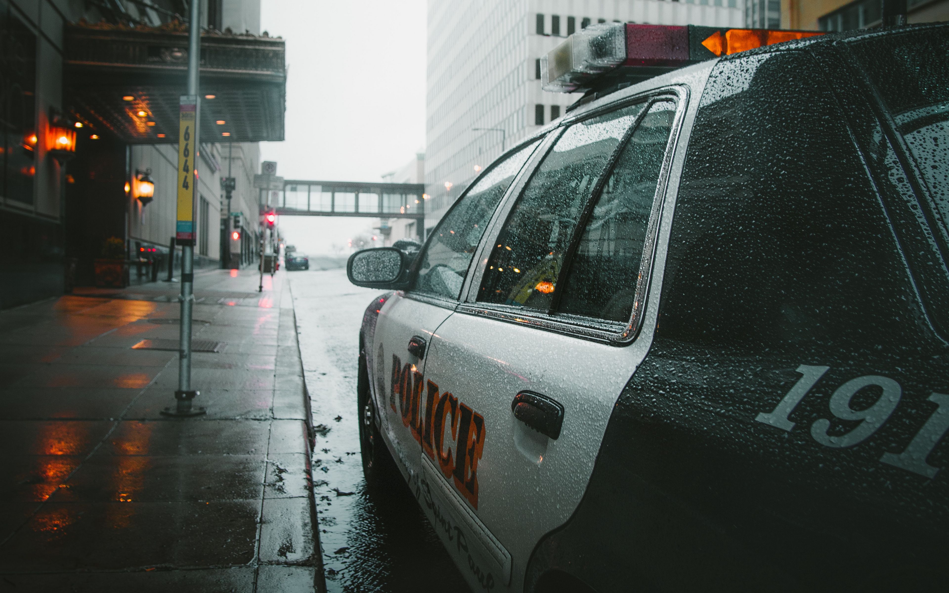 Download wallpaper 3840x2400 police, car, street, city, rain 4k ultra HD 16:10 HD background