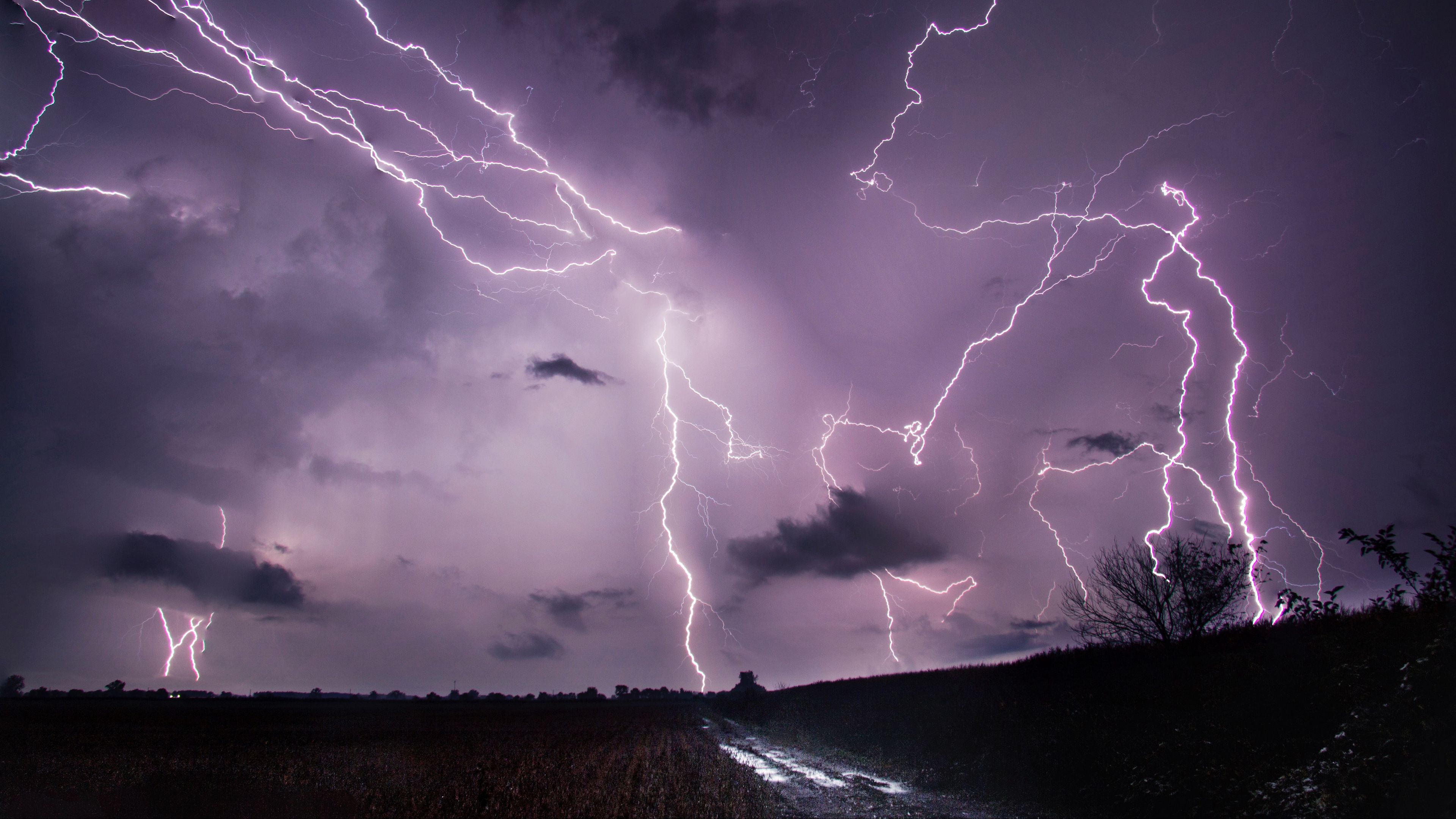 Wallpaper / lightning, thunderstorm, road, field, 4k free download