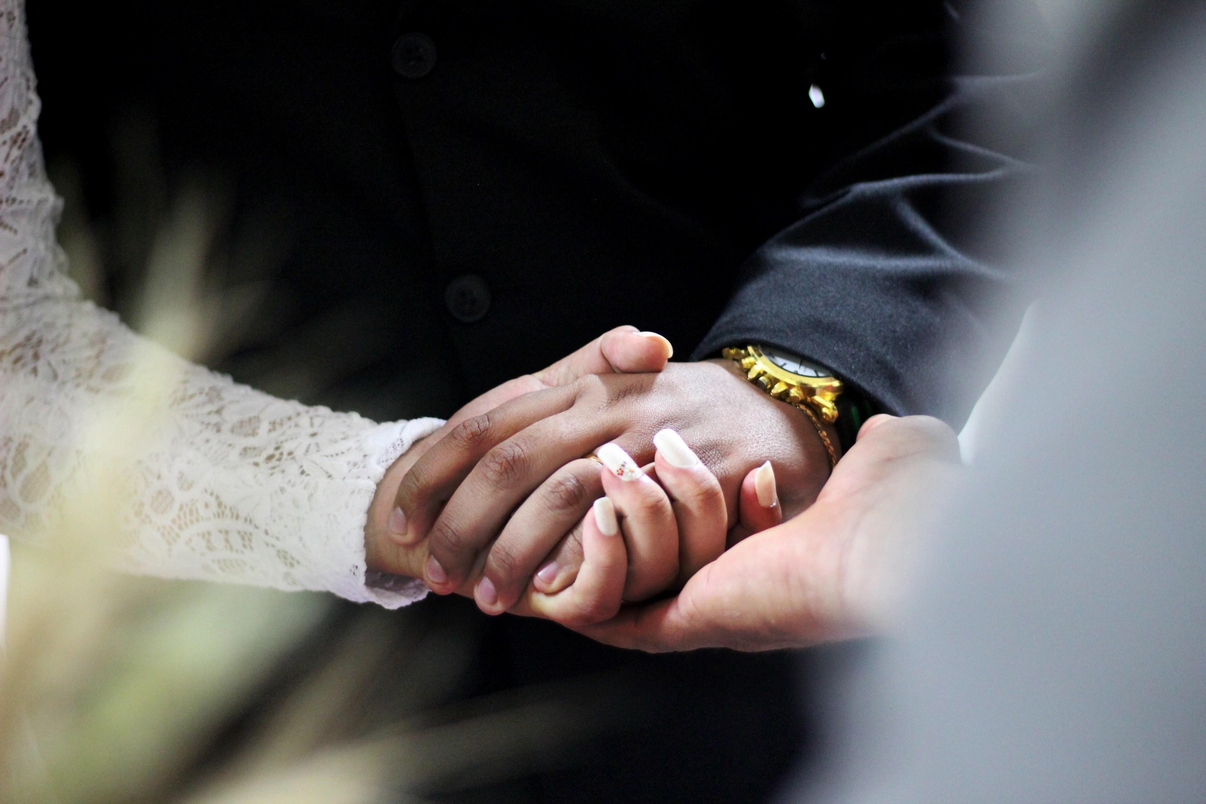 Wallpaper / a couple holds hands as they take their vows during a wedding ceremony, _wedding couples hands 4k wallpaper free download