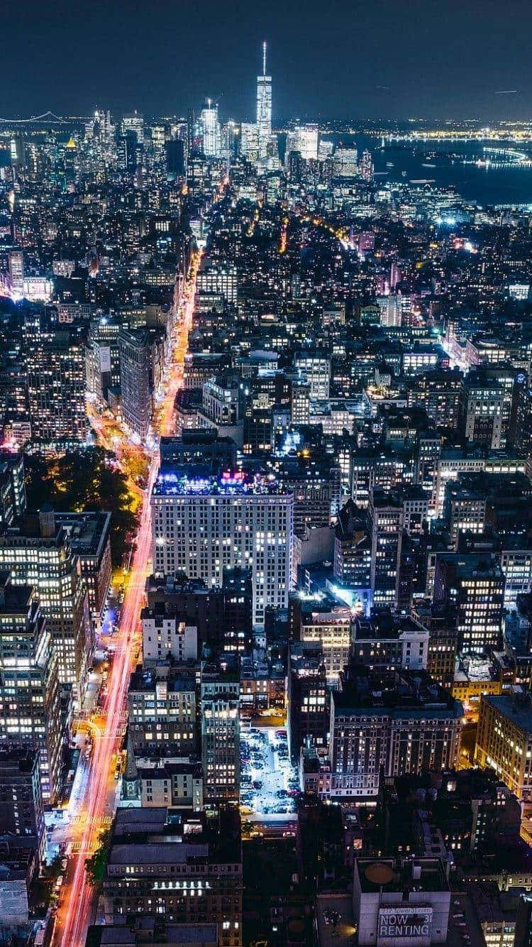 Download “Embrace the spectacular night city lights of New York City on your iPhone.” Wallpaper